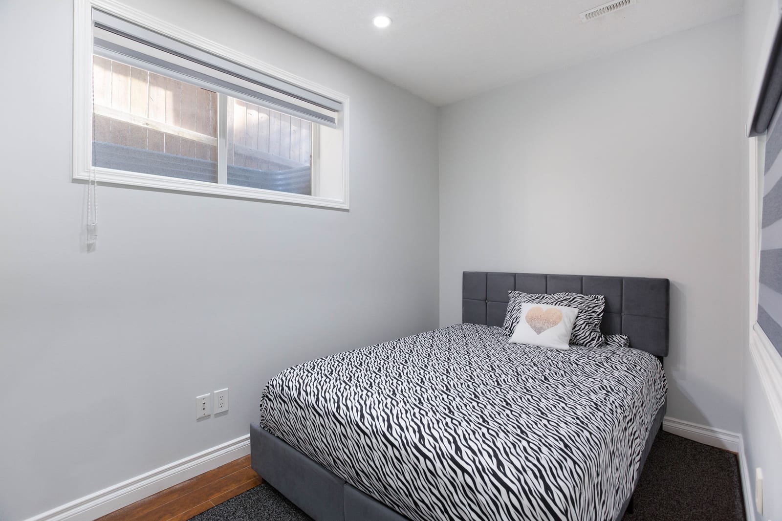 Lower-level bedroom with window