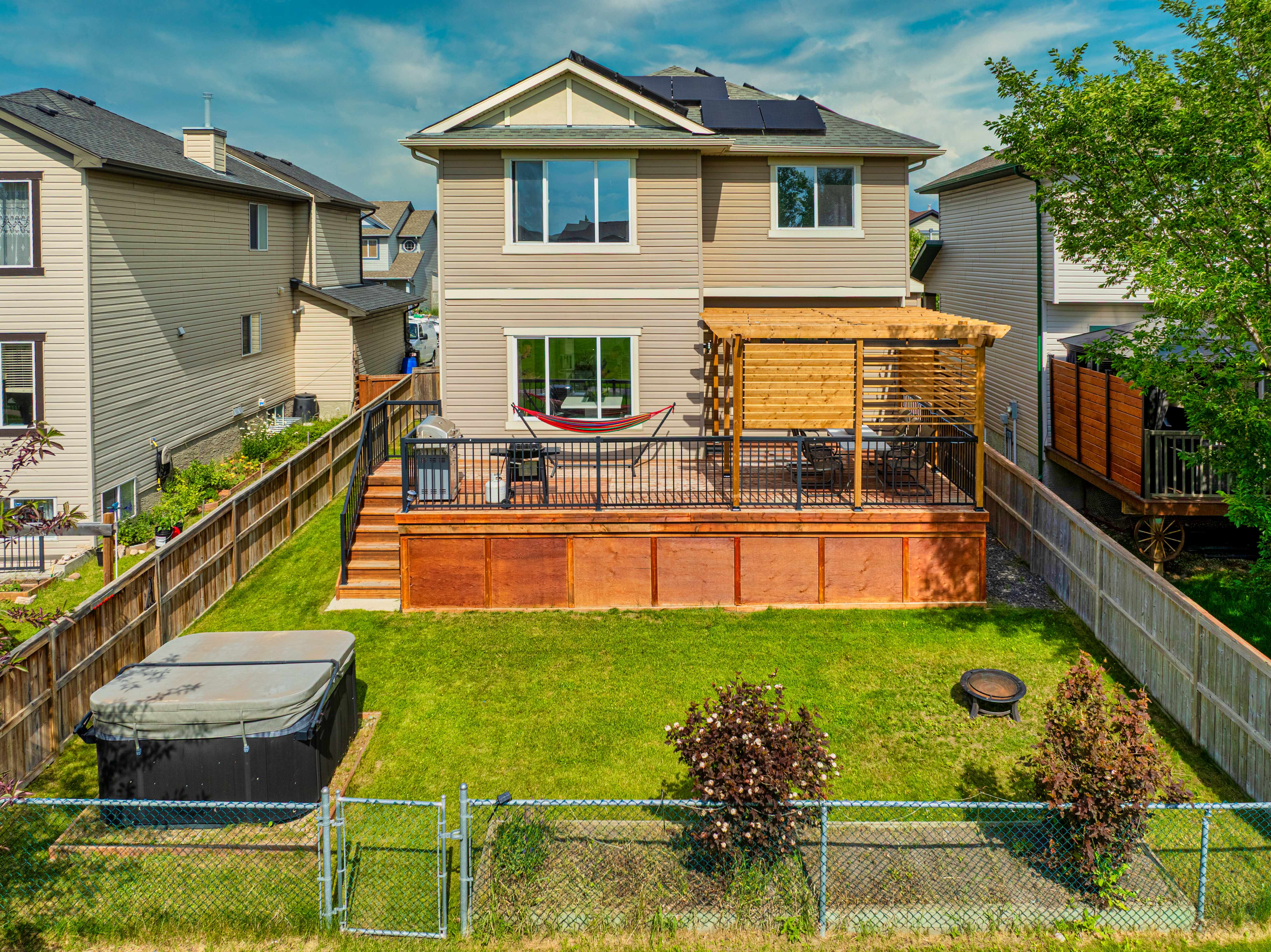 Rear exterior, deck and lawn