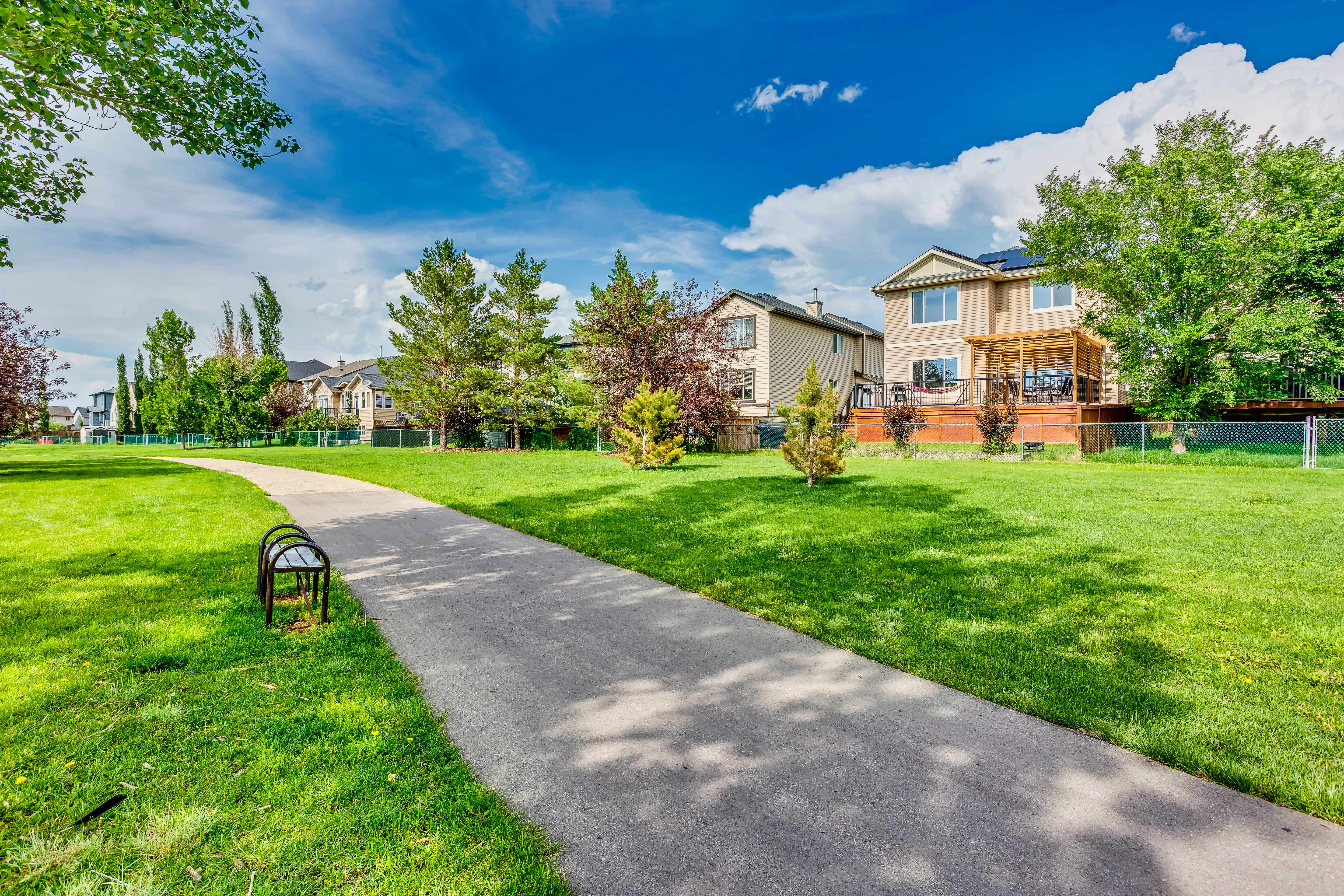 Walking pathway through greenspace behind the home