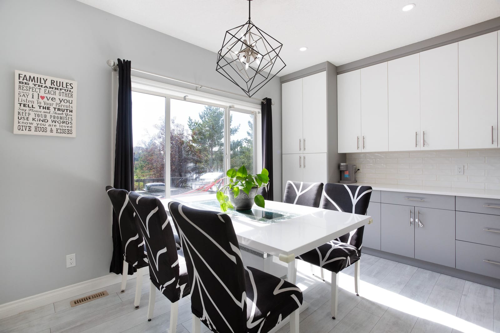 Dining area beside backyard windows