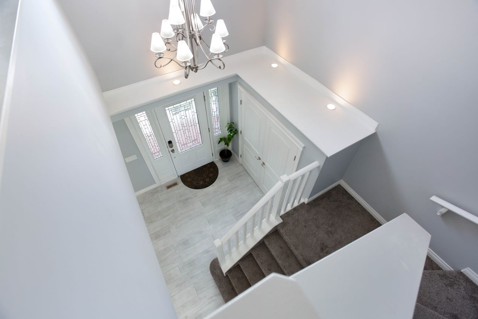 Staircase overlooking front entry