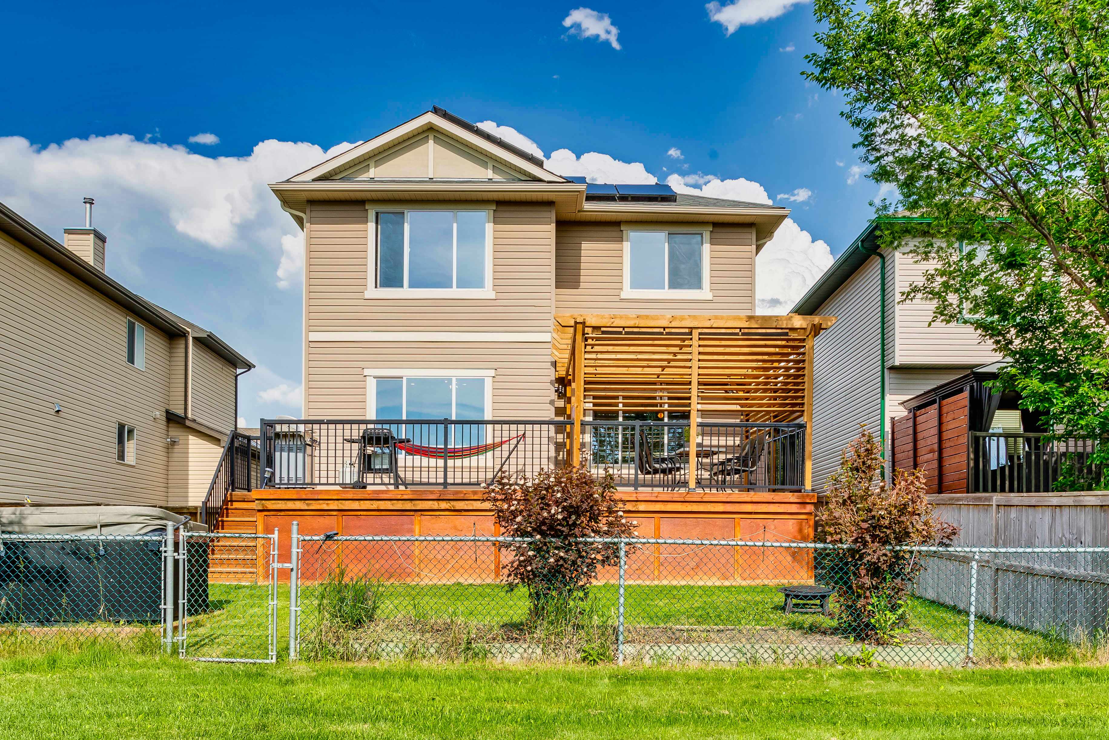 Rear exterior with deck and pergola