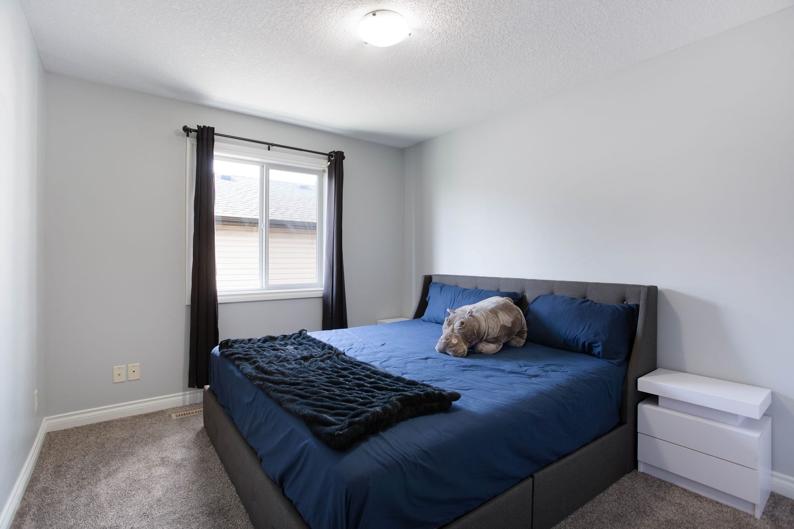 Bedroom with blue bedding