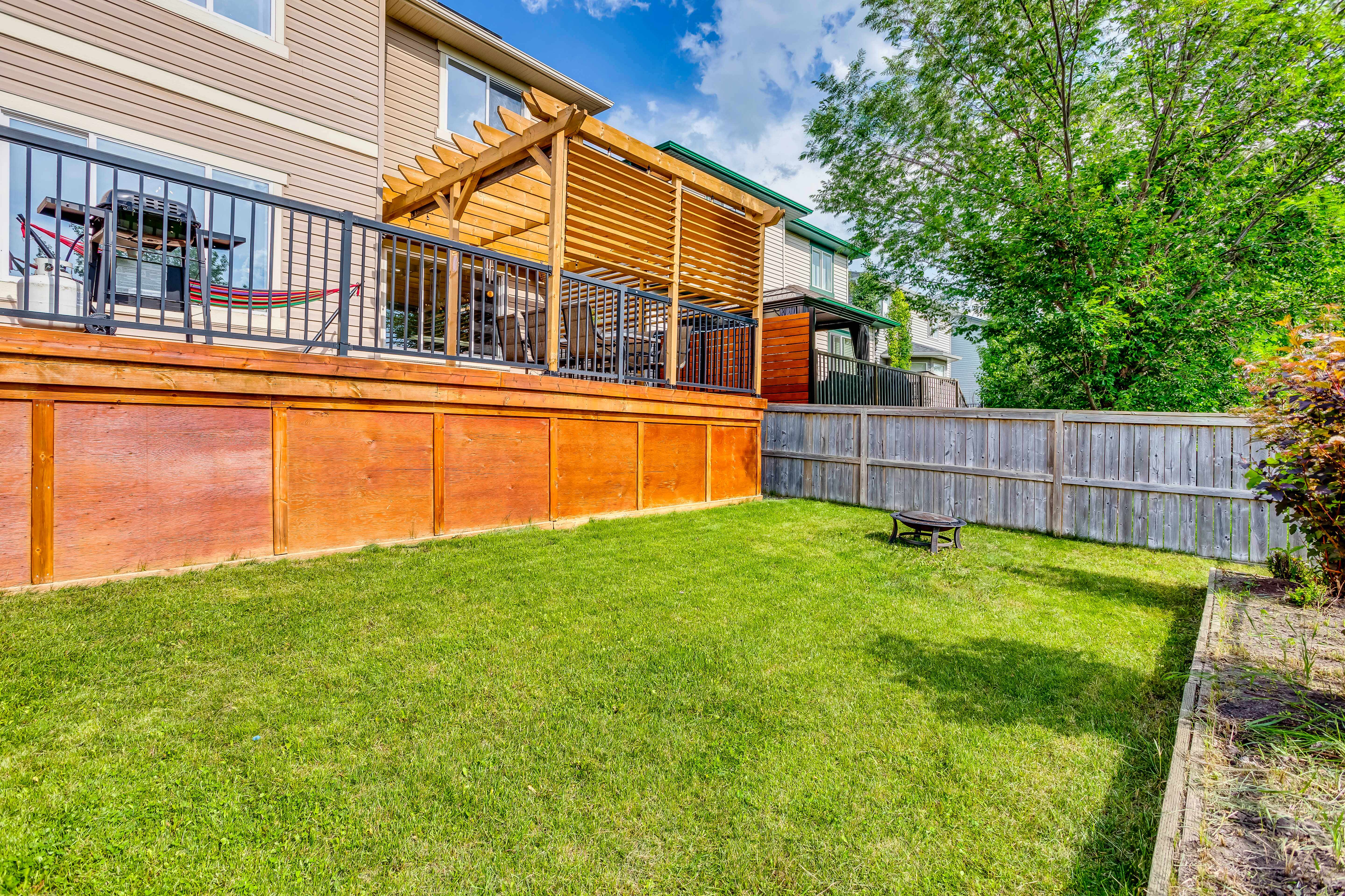 Backyard lawn and raised deck