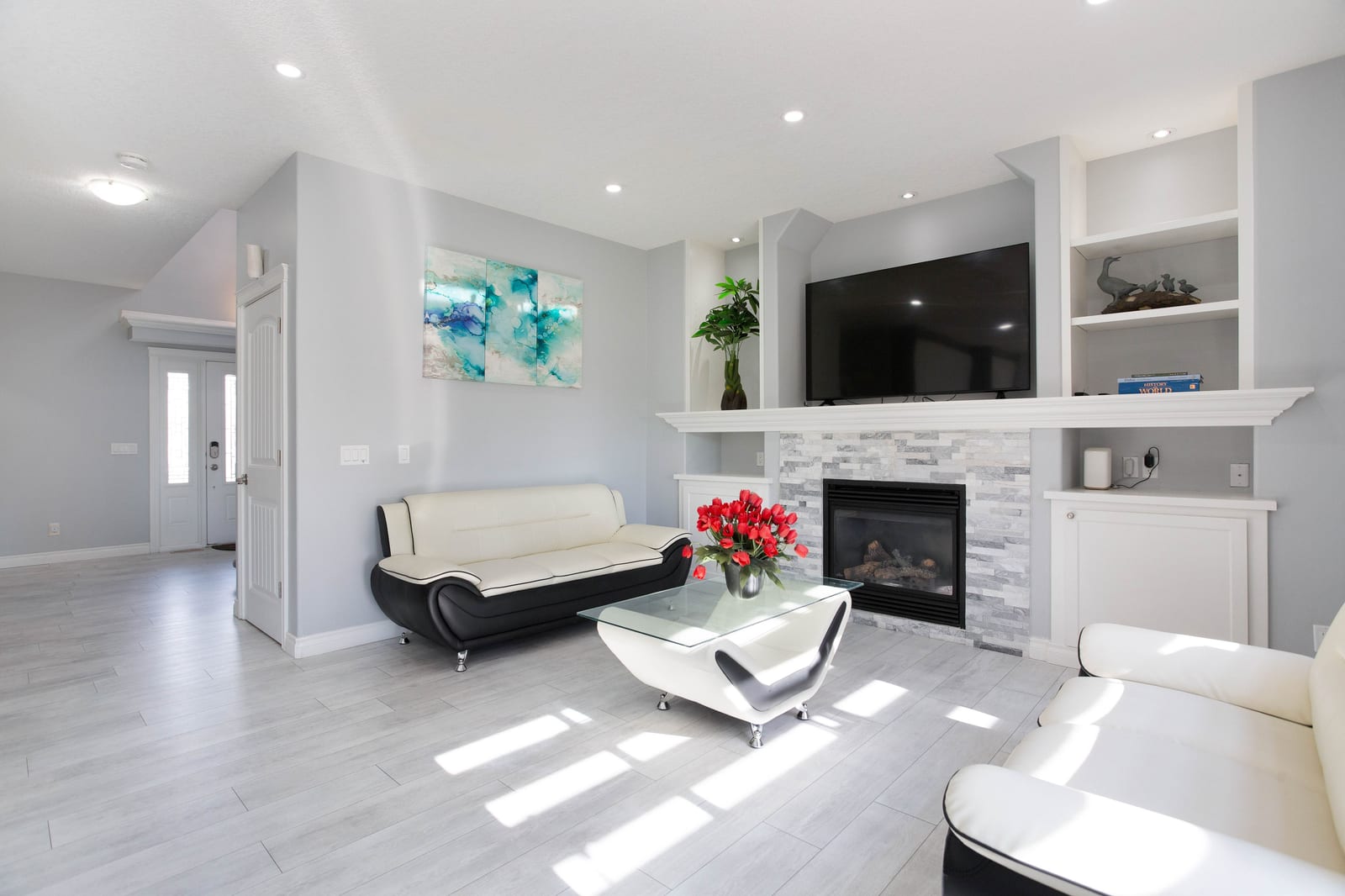 Main living room with fireplace and built-in shelving