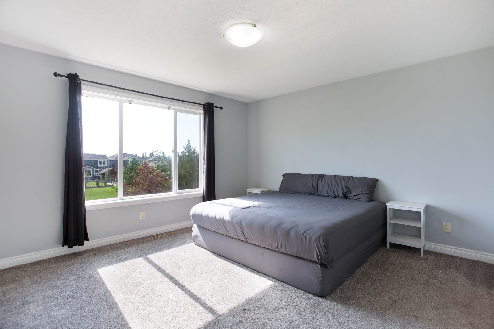 Bedroom with broad window