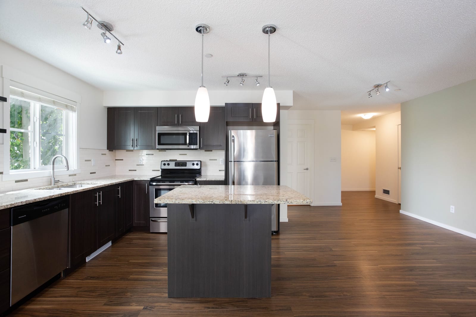 Kitchen island and dark cabinetry
