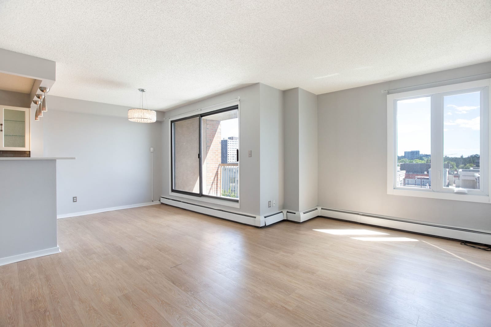 Unfurnished living room with south-facing windows