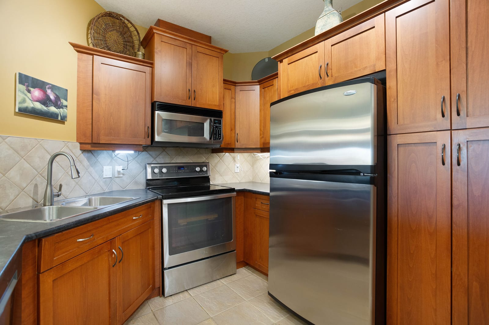 Kitchen cabinetry and stainless-steel appliances