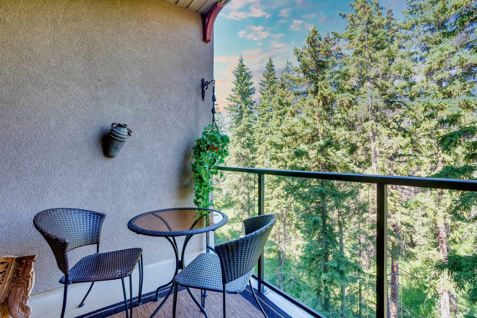 The sheltered balcony overlooking trees
