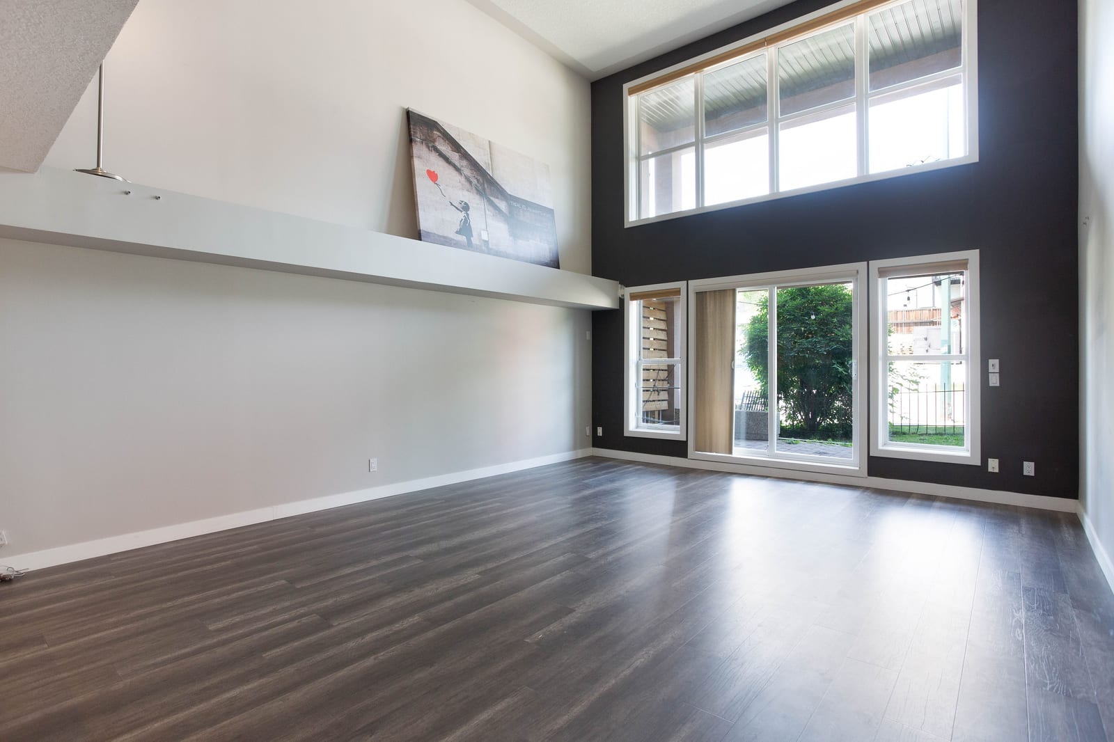 The unfurnished double-height living room
