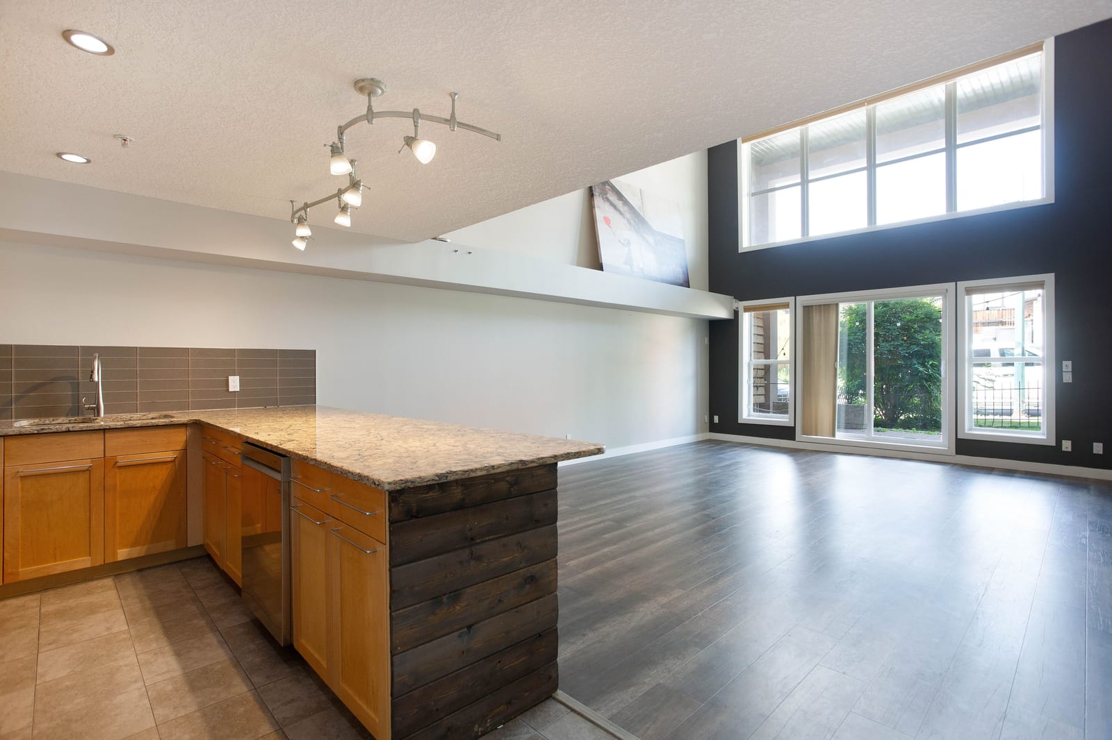 The kitchen looking toward the tall windows