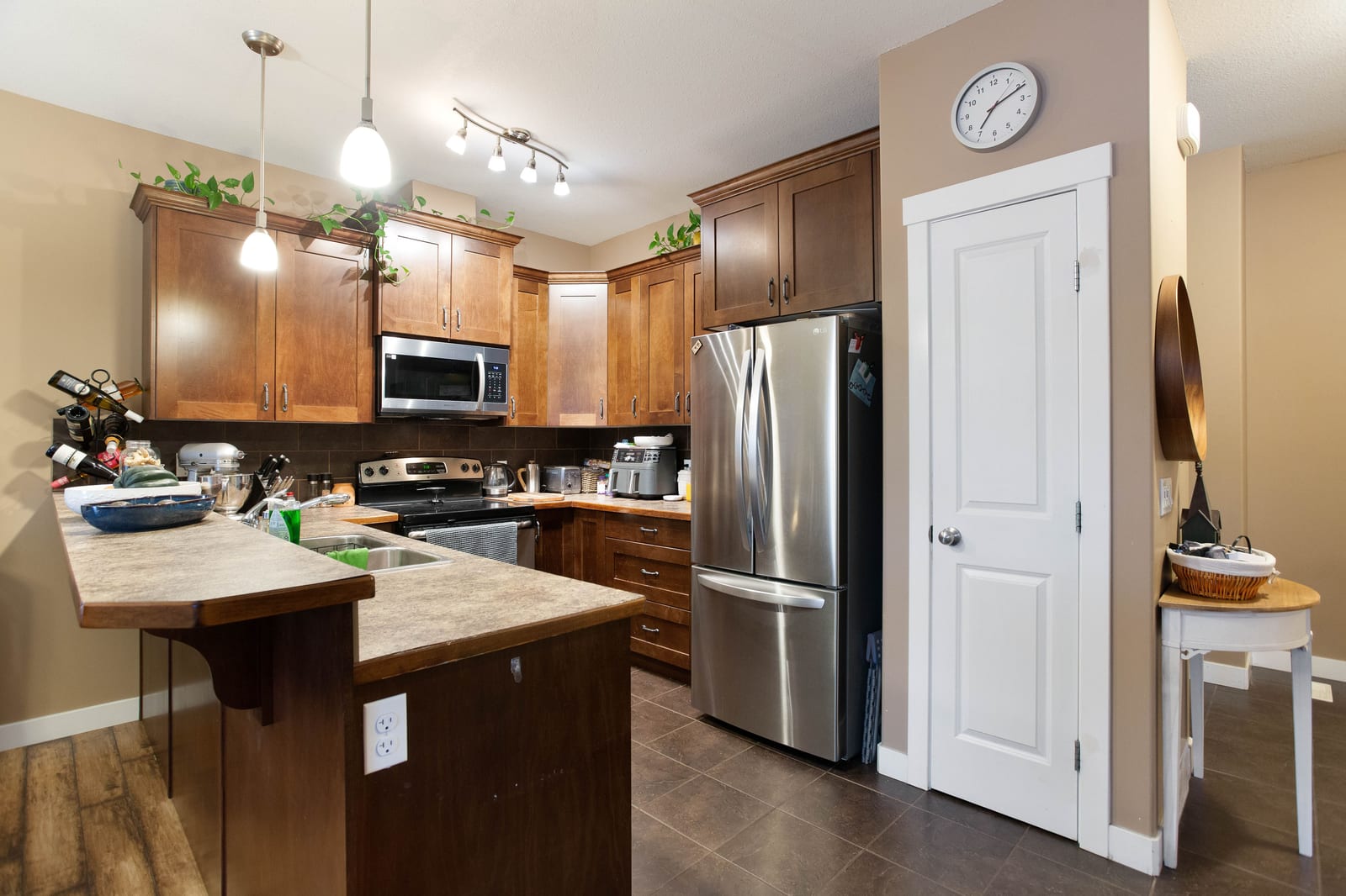 Kitchen cabinetry and peninsula — 317 Ranch Ridge Meadow N, Strathmore