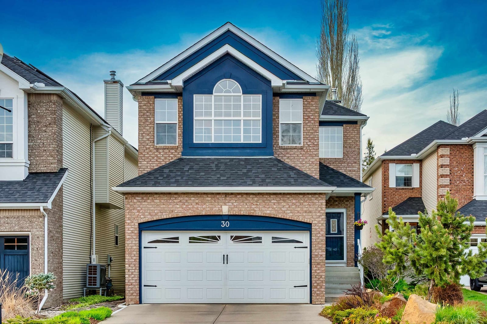 Front exterior and landscaped approach