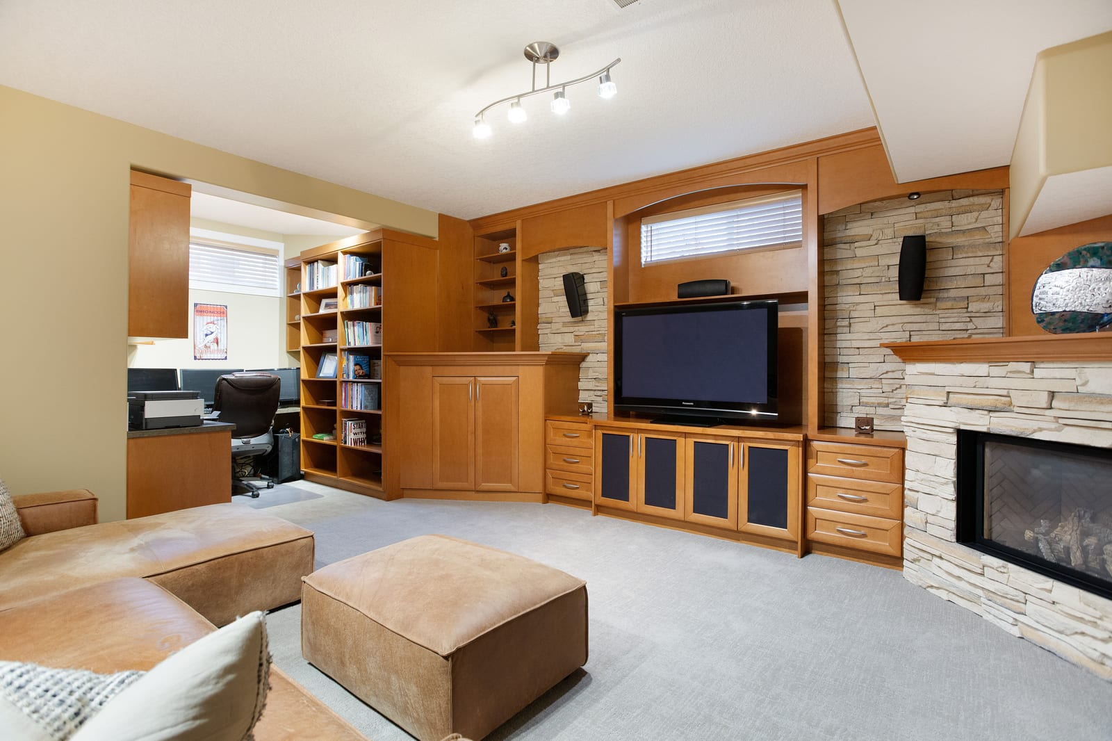 Lower-level family room with built-ins and fireplace