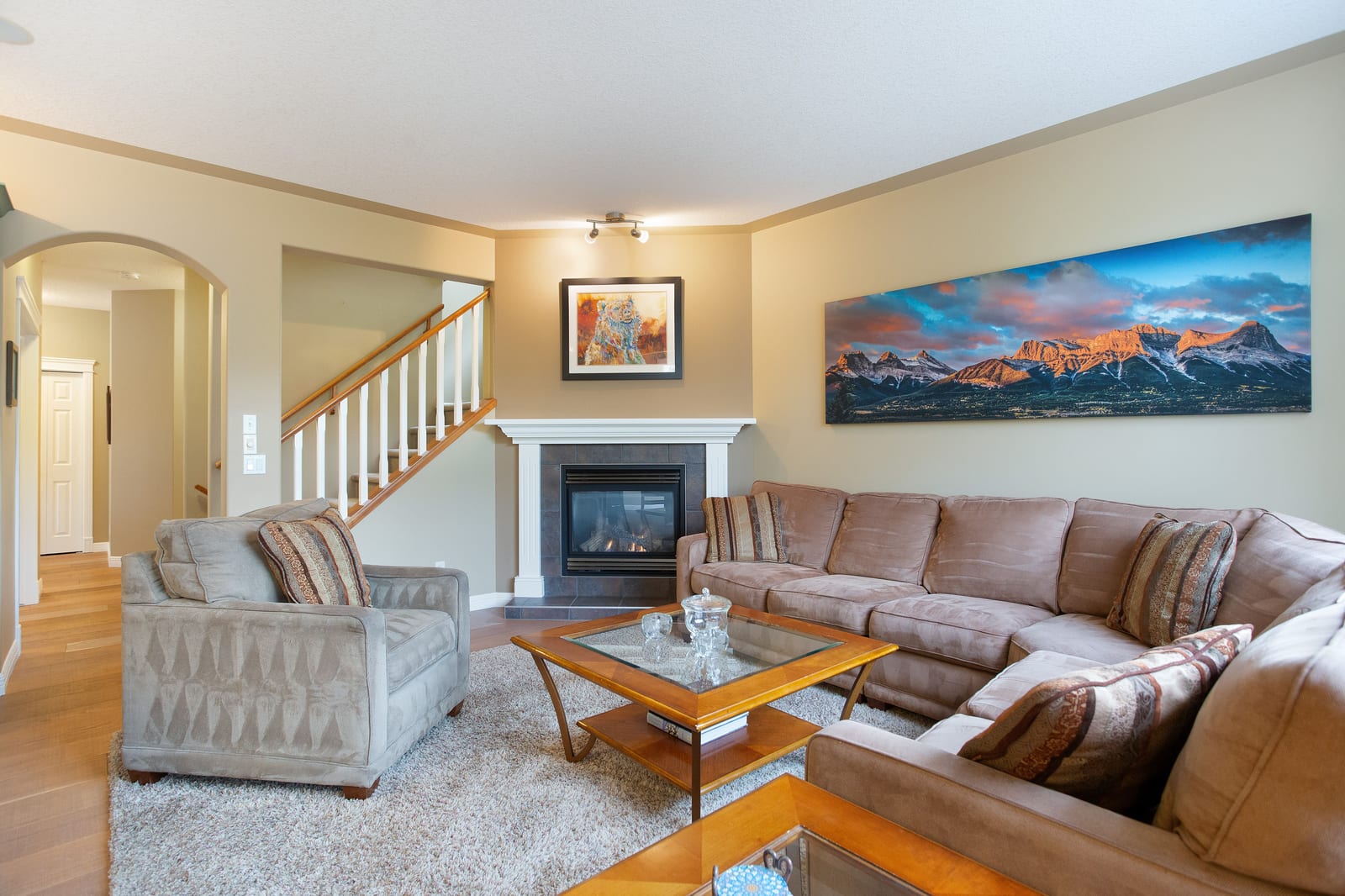 Main living room with fireplace and stairs