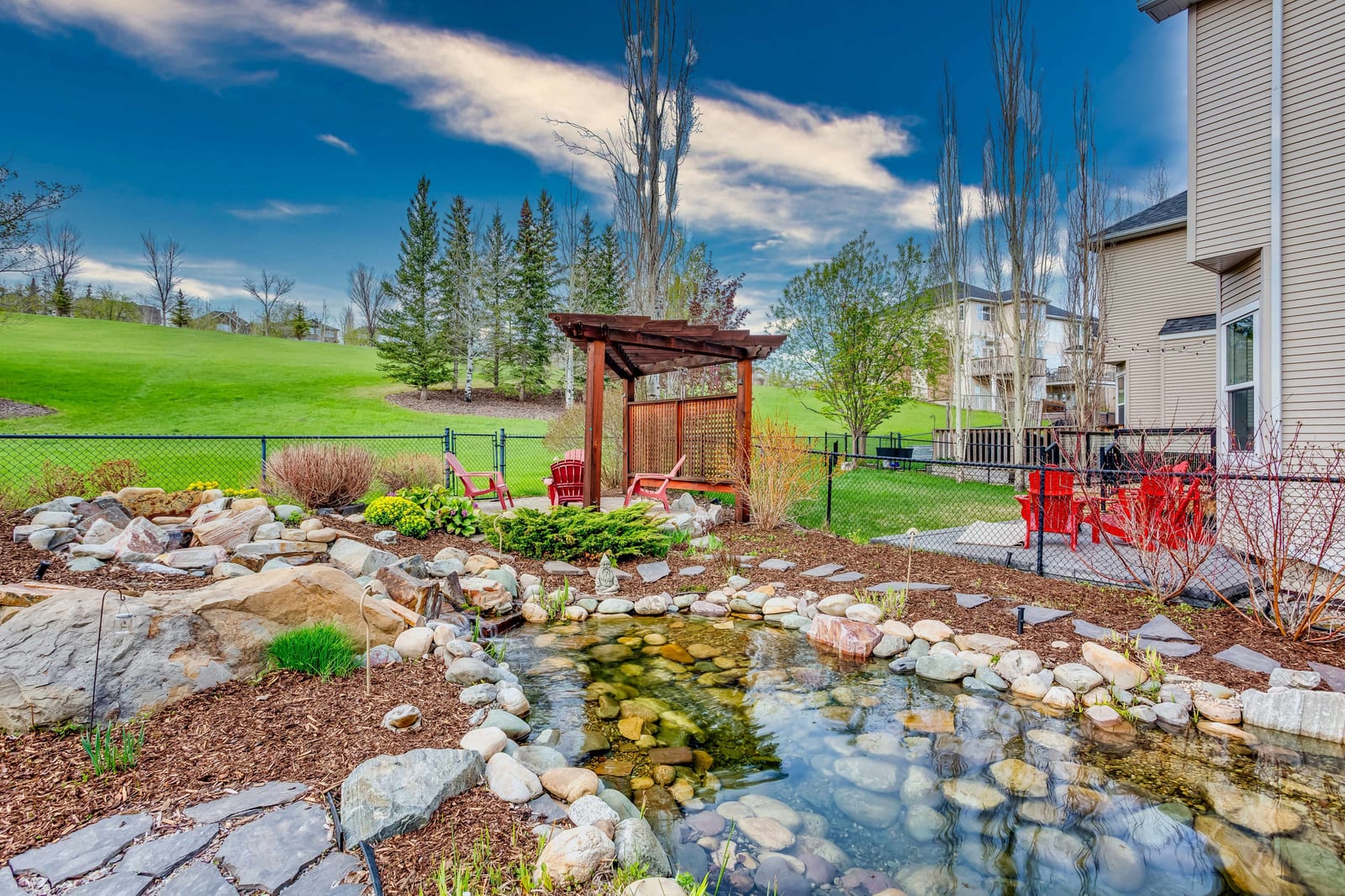Landscaped garden with ornamental water feature