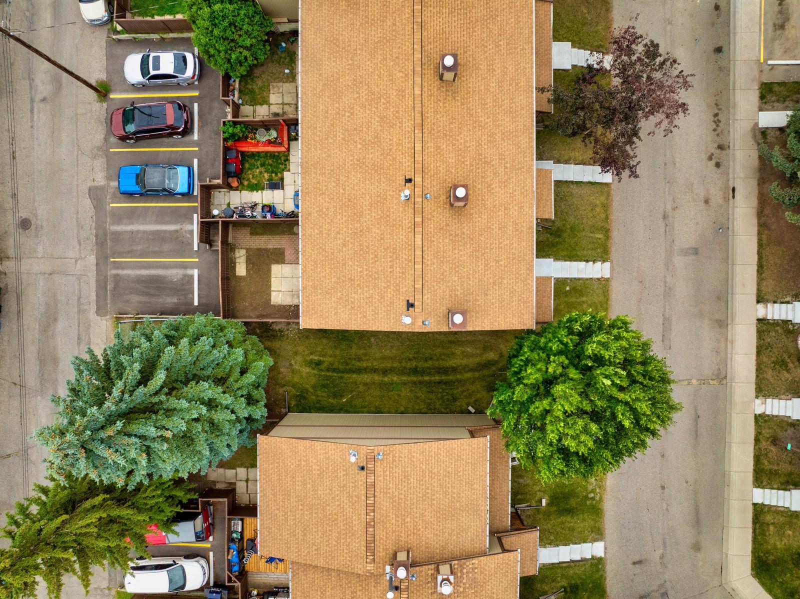 Overhead view of townhome buildings and parking