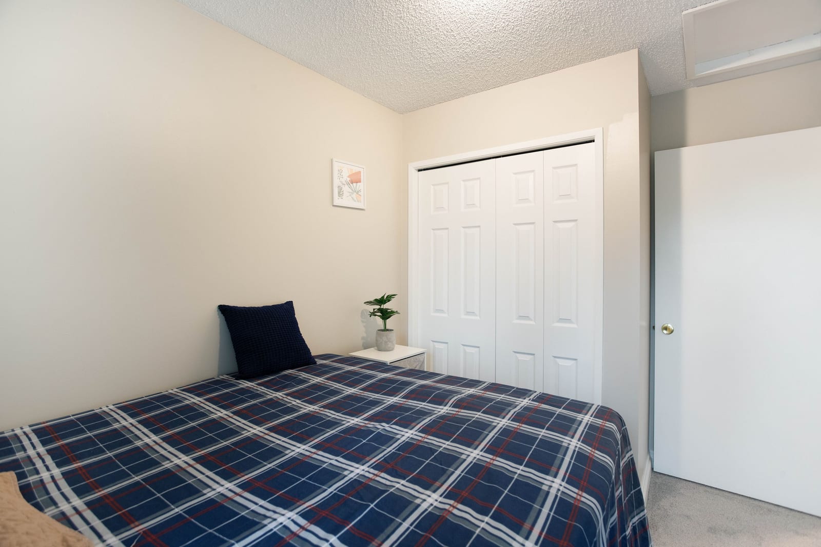 Bedroom closet and bed