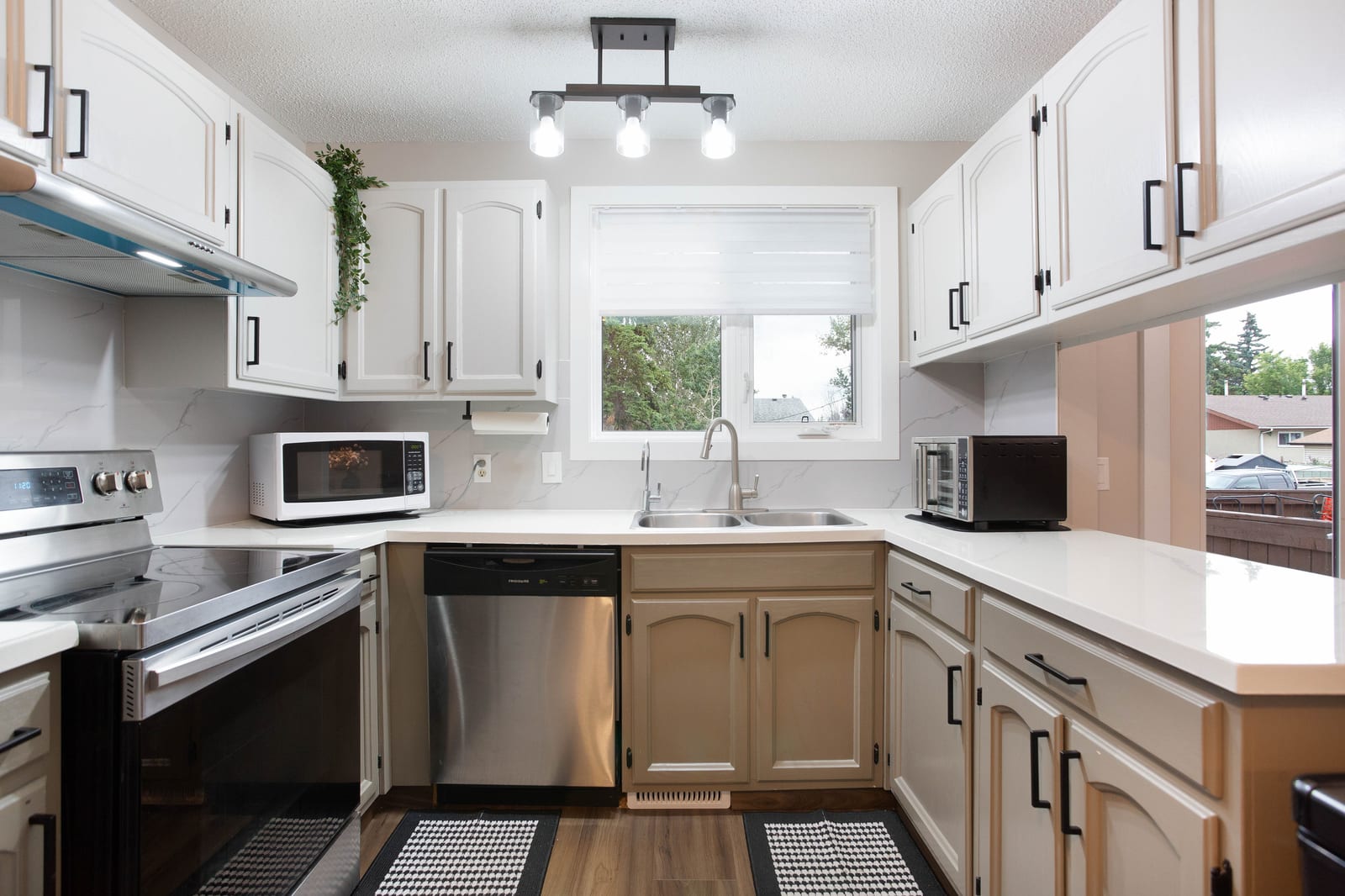 Refreshed kitchen with two-tone cabinetry