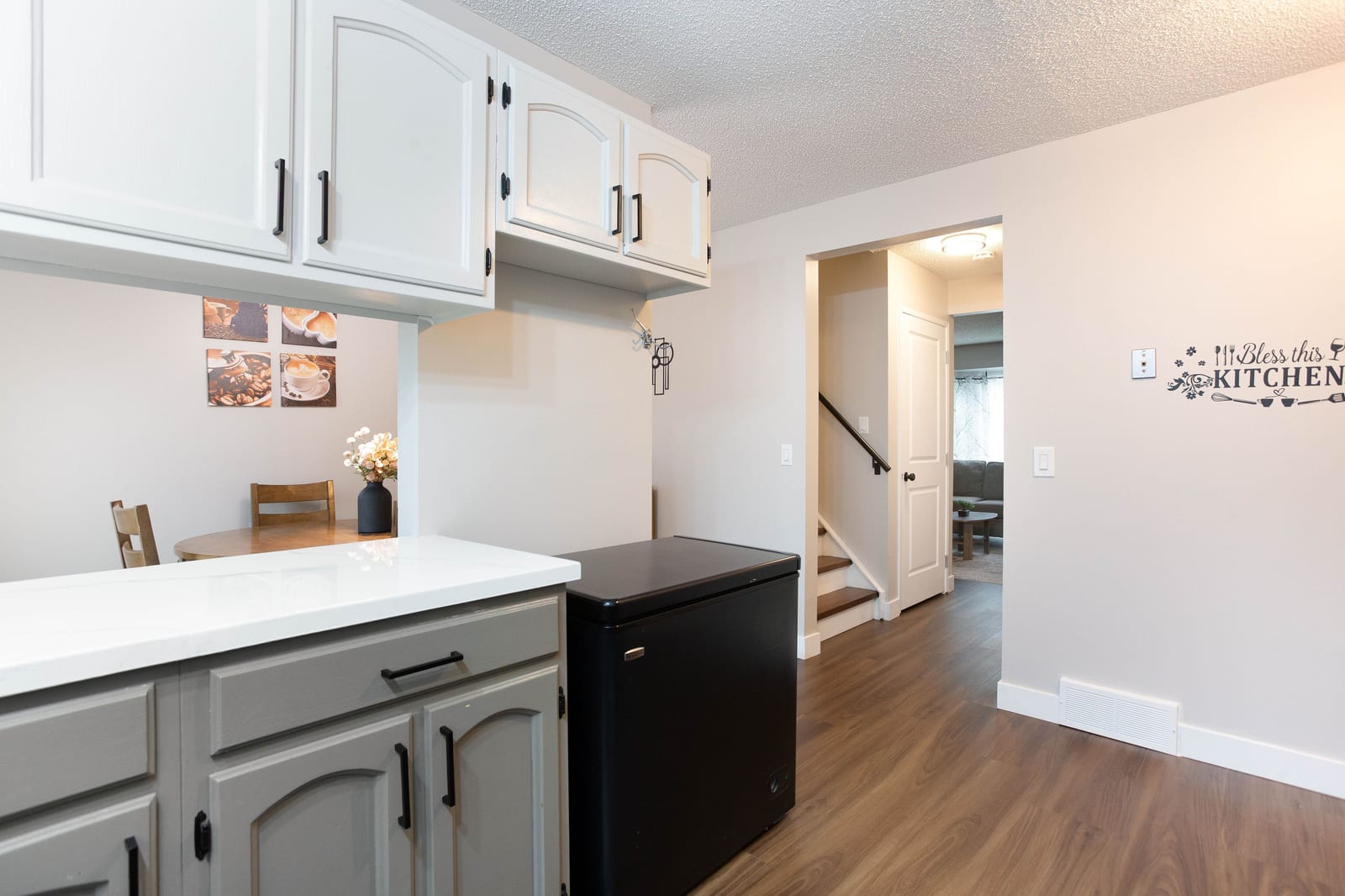 Kitchen looking toward dining and hallway