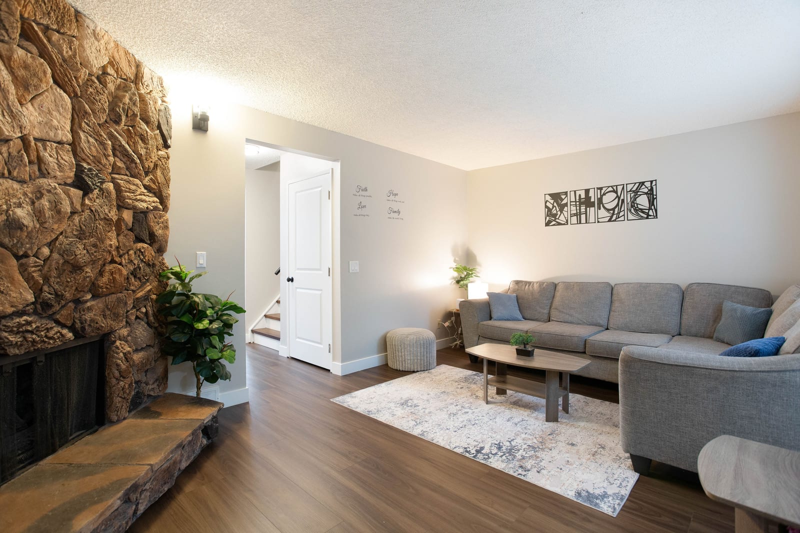 Living room with stone-faced fireplace