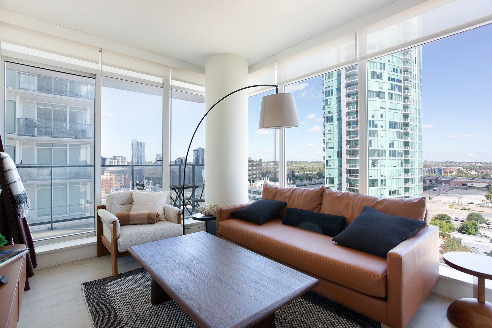 Corner living room framed by floor-to-ceiling windows