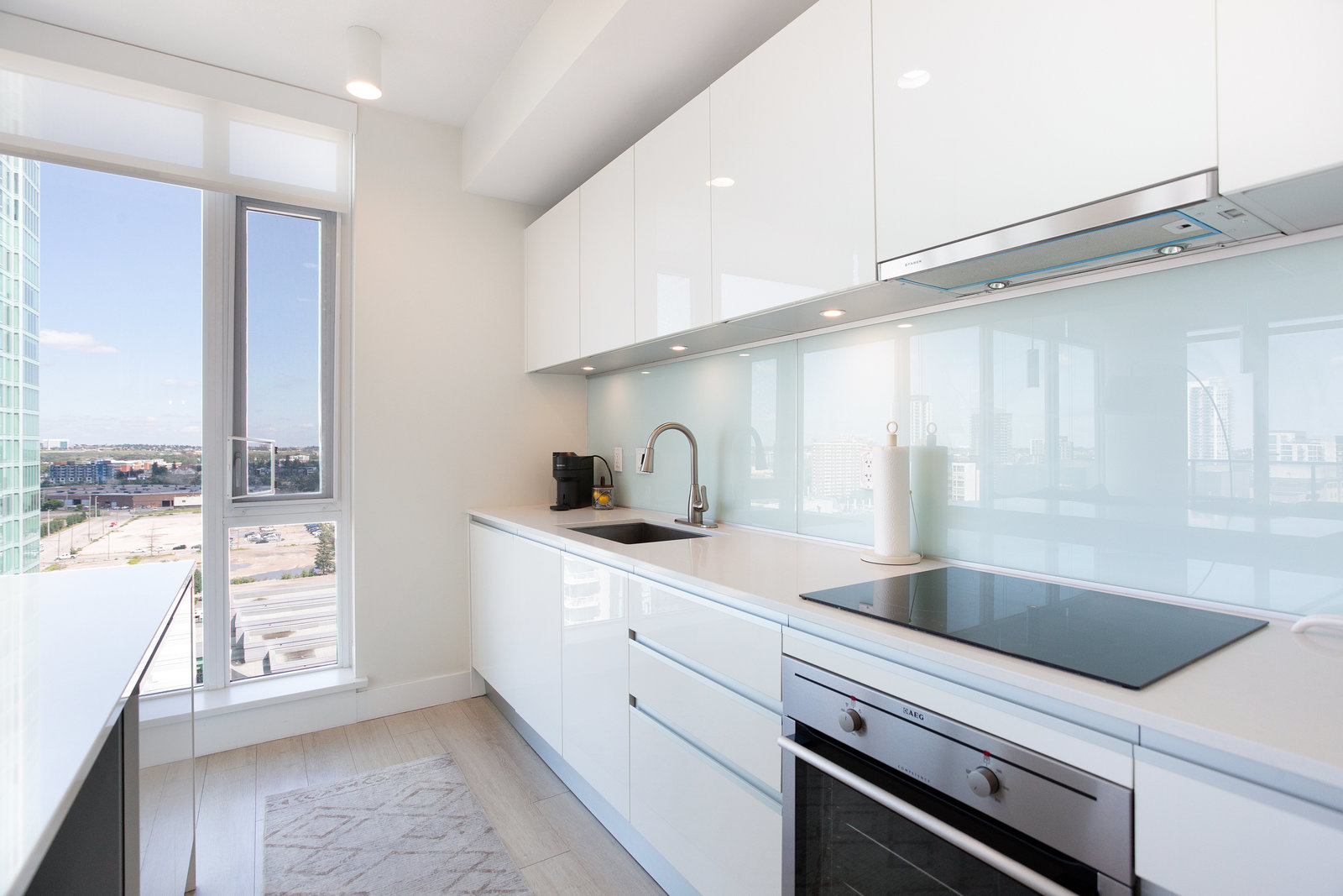 Kitchen cooktop and floor-to-ceiling windows