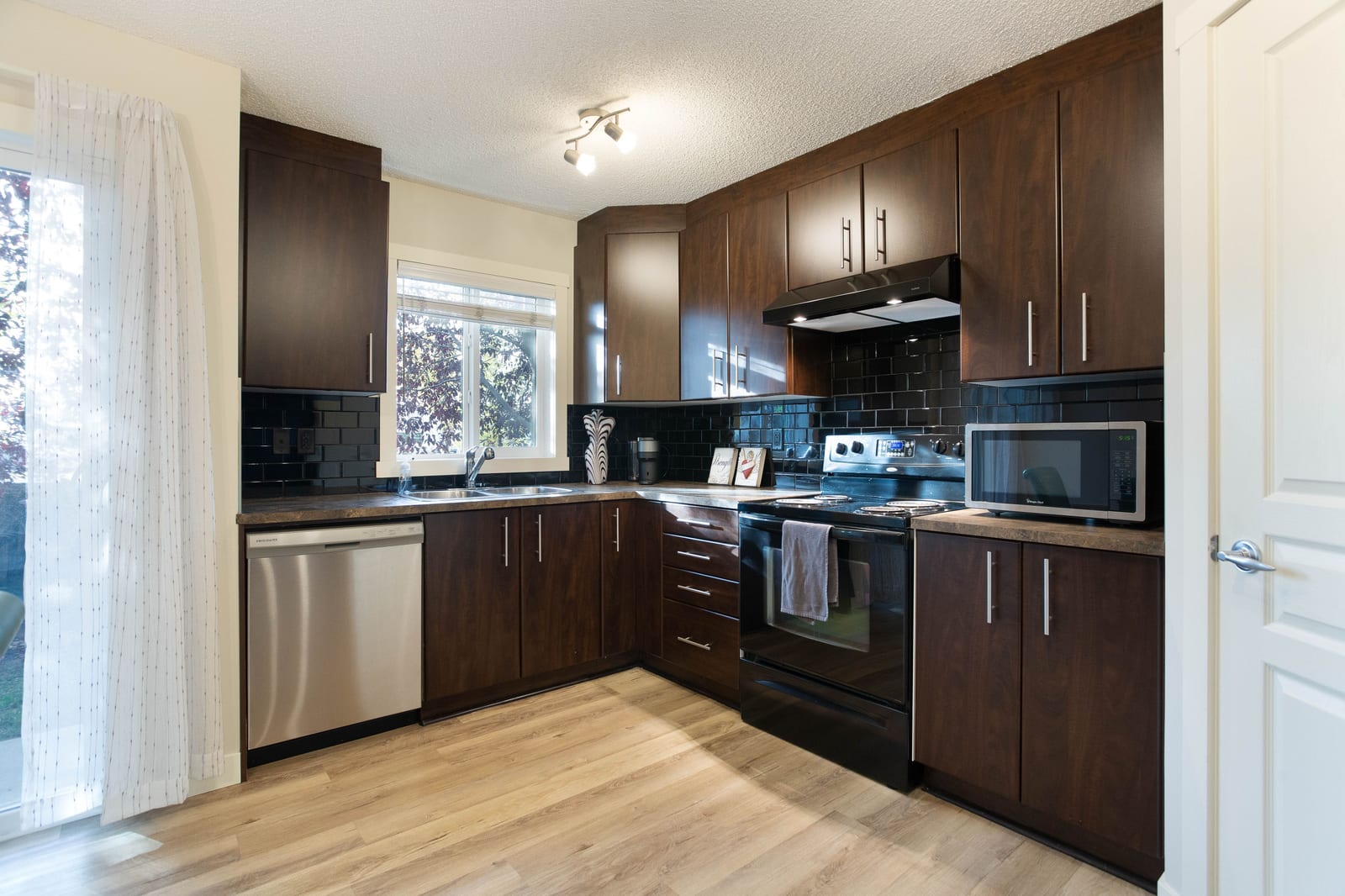 Dark cabinetry and kitchen workspace
