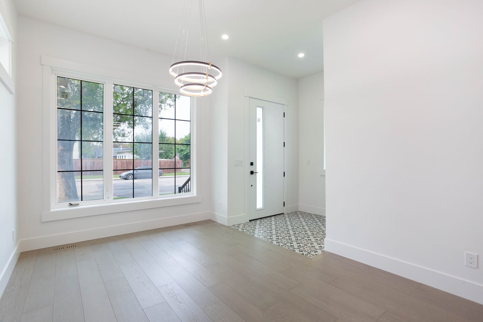Unfurnished dining room with large front window — 1108 6 Street NE, Renfrew