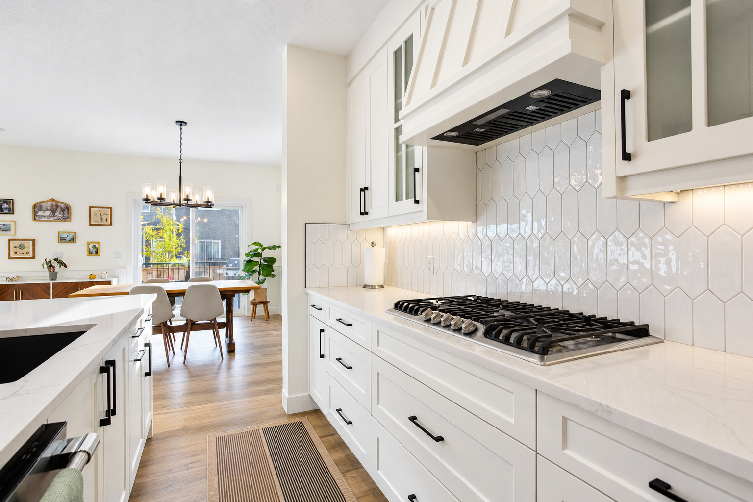 Kitchen cooktop and backsplash toward dining area — 809 Mandalay Link