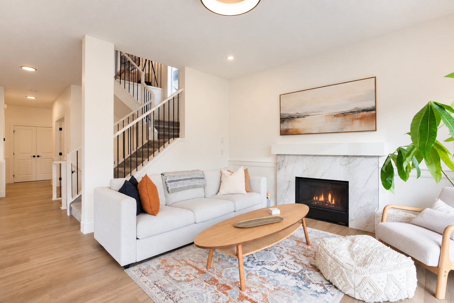 Living room with fireplace and open staircase — 809 Mandalay Link