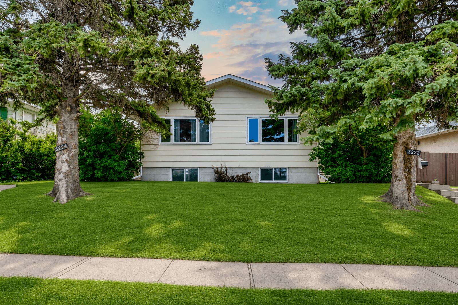 Front exterior with mature trees