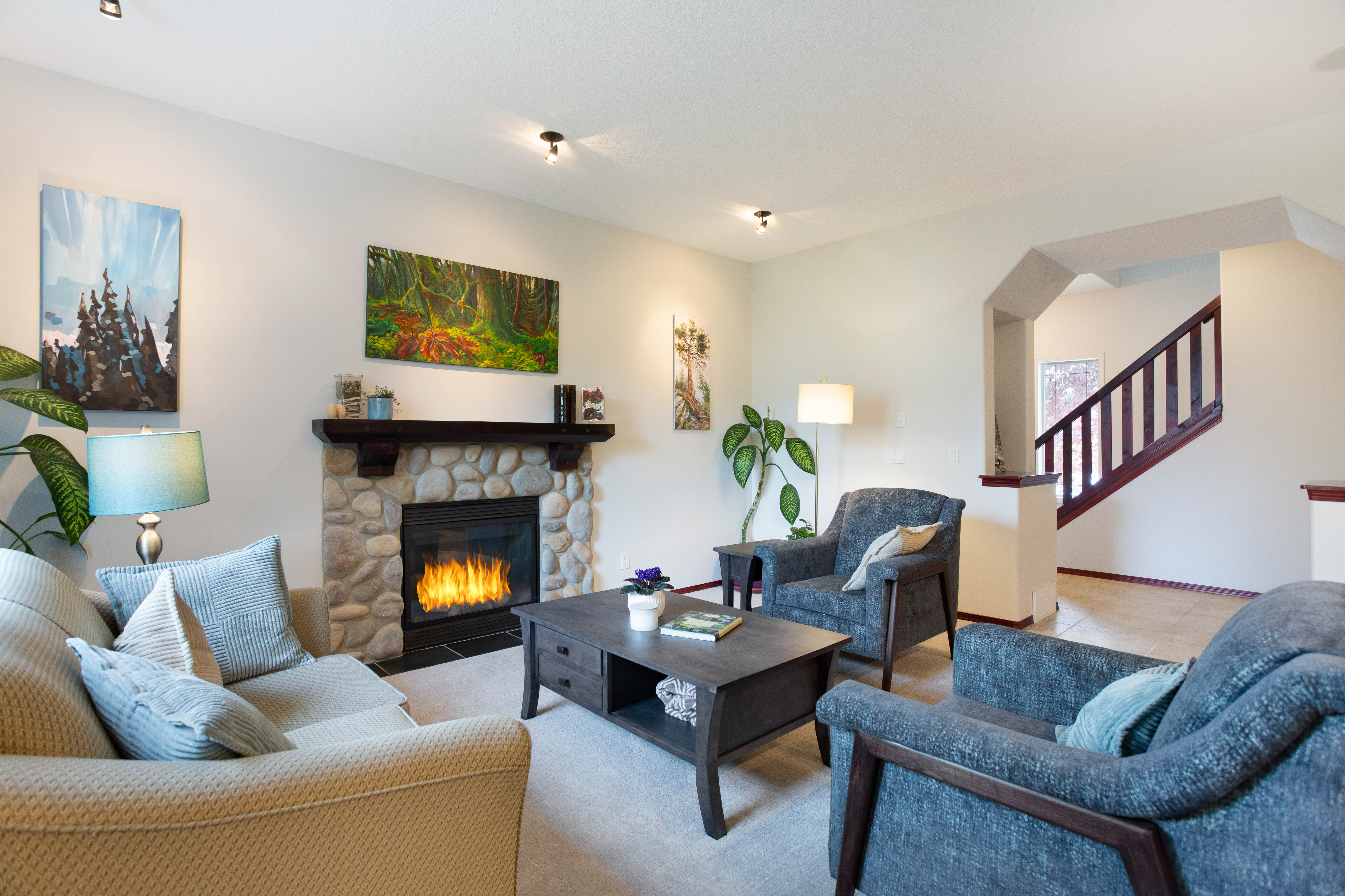Living room windows and gathering space — 66 Cougarstone Close SW, Calgary
