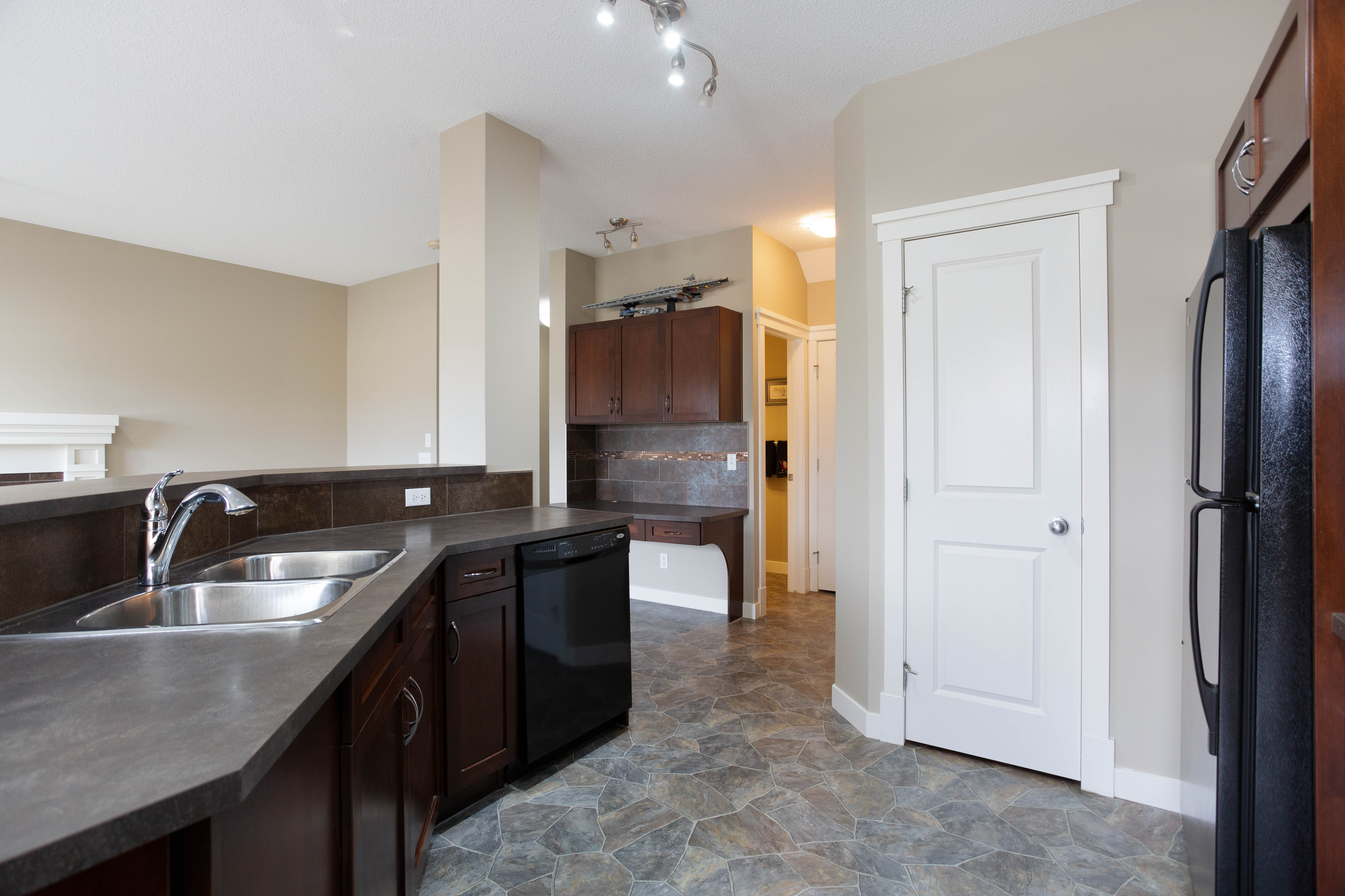 Kitchen sink and window — 119 Sage Hill Green NW