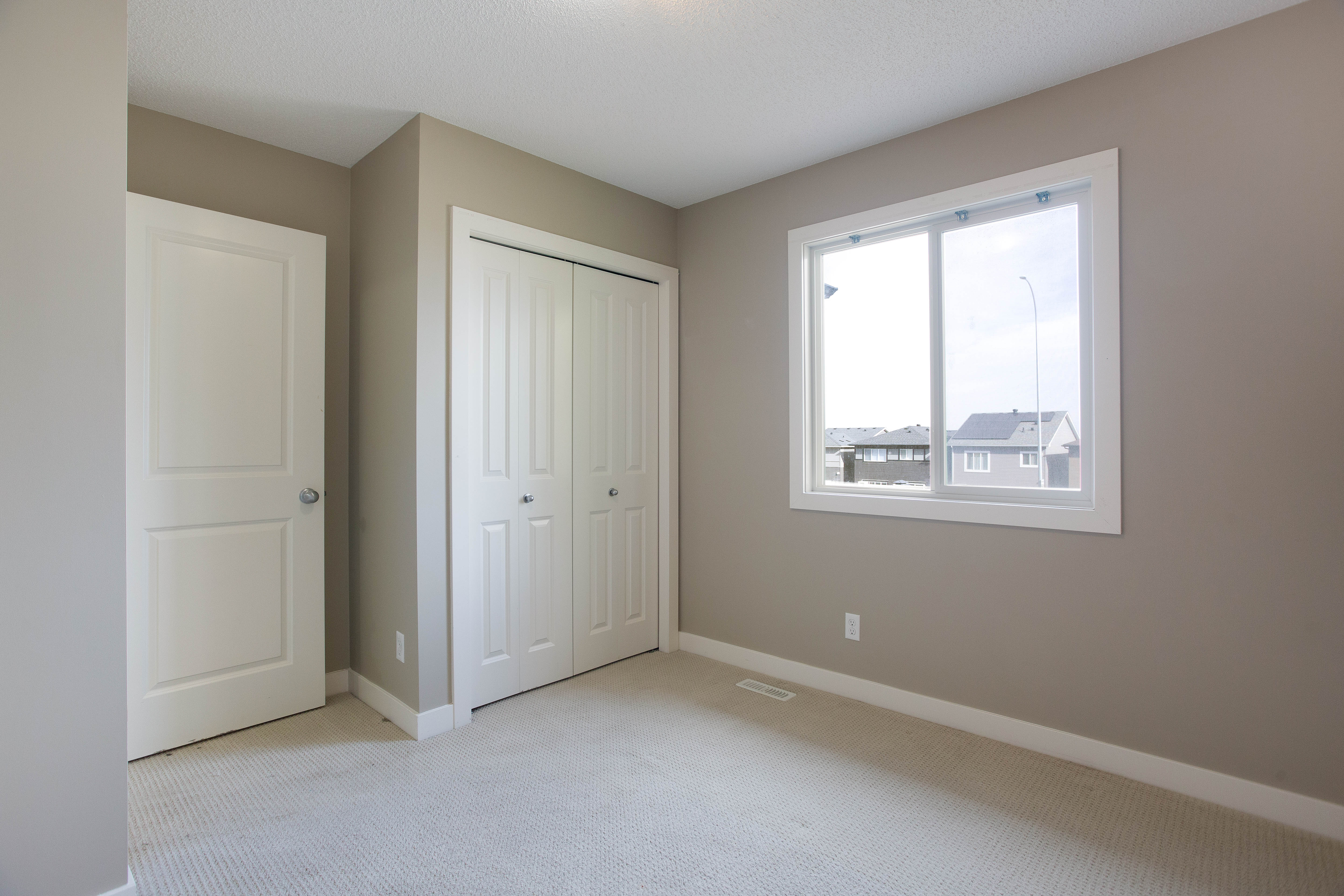 Bedroom and closet — 119 Sage Hill Green NW