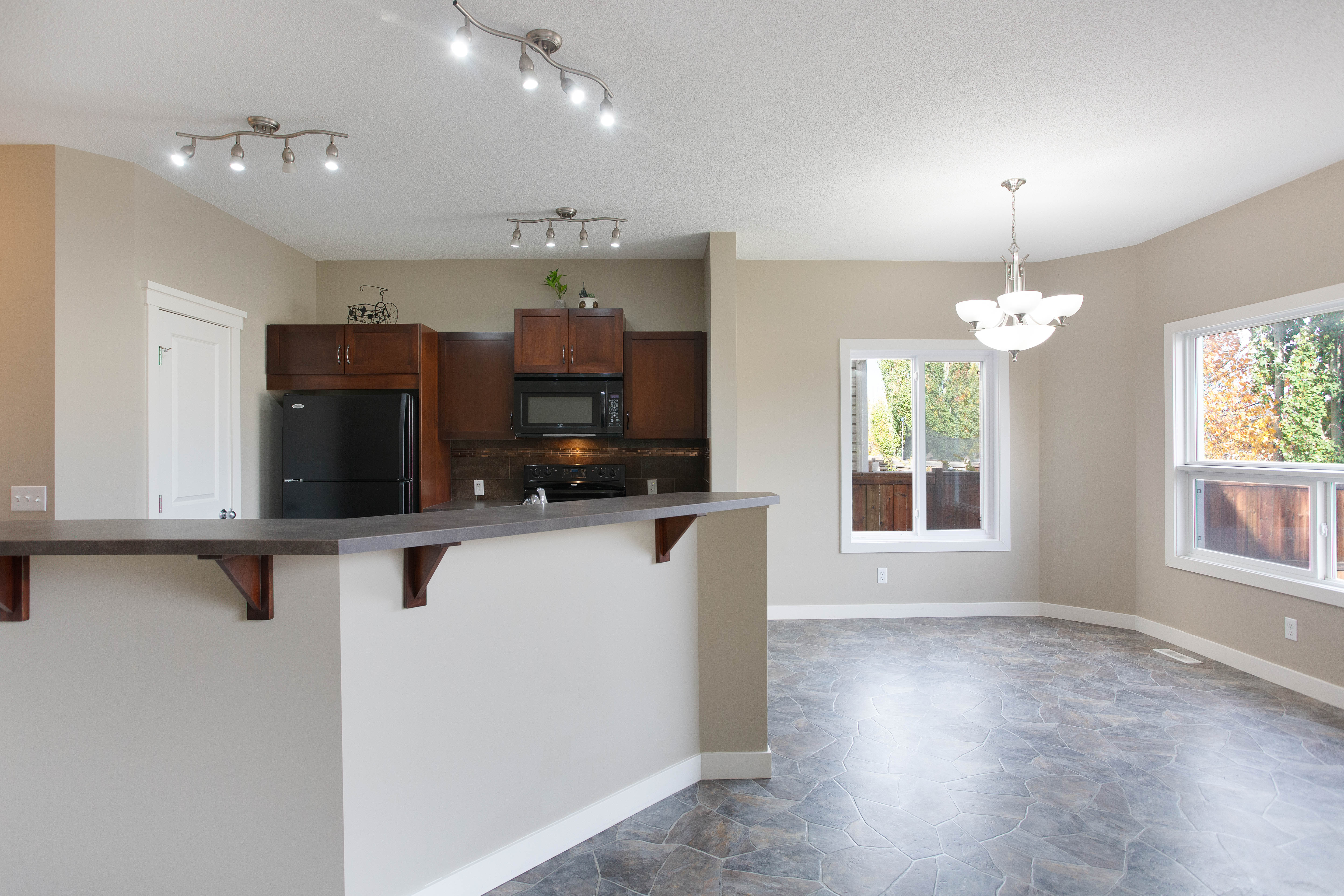Kitchen toward the dining area — 119 Sage Hill Green NW