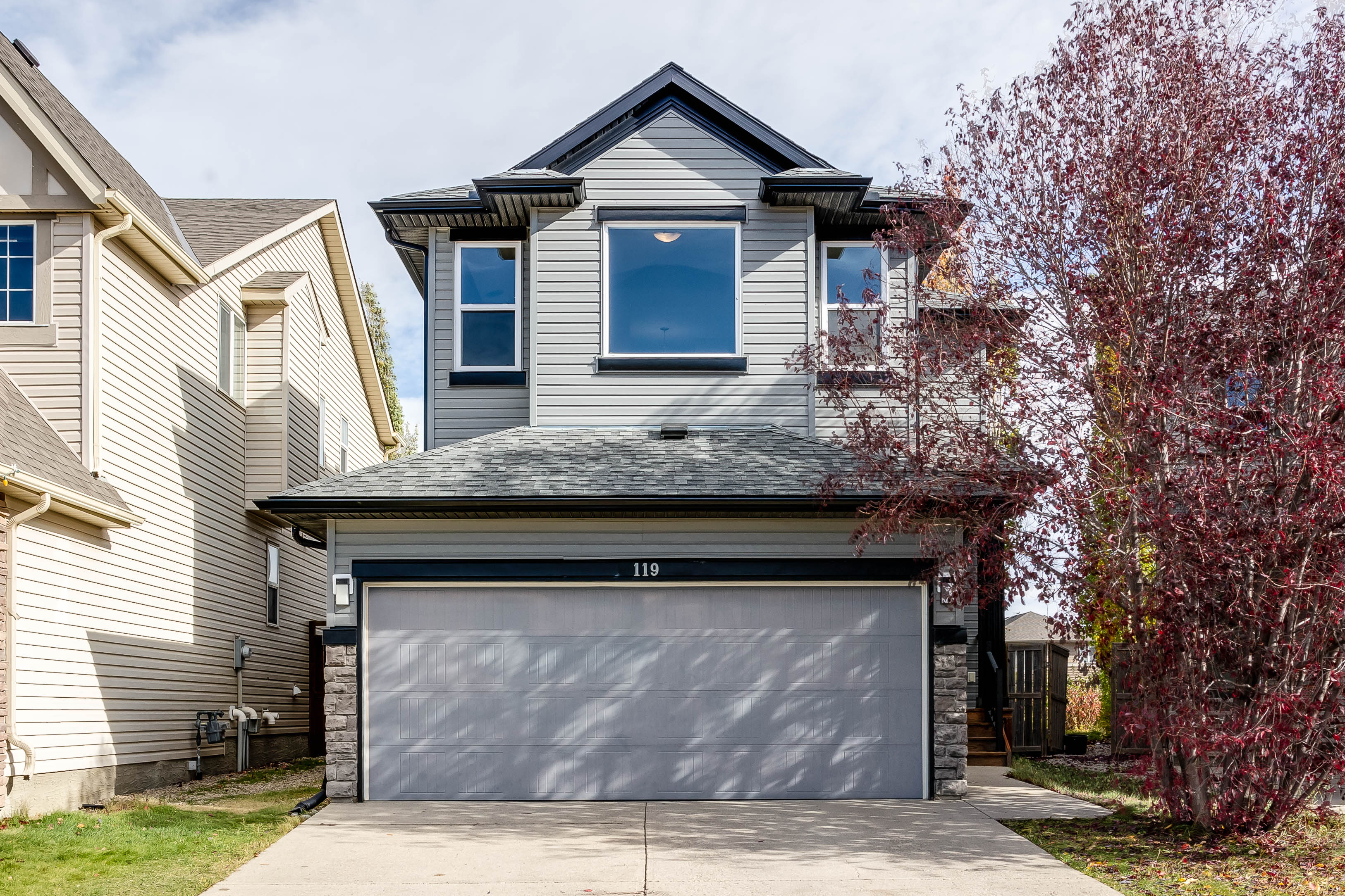 Front elevation and double attached garage — 119 Sage Hill Green NW