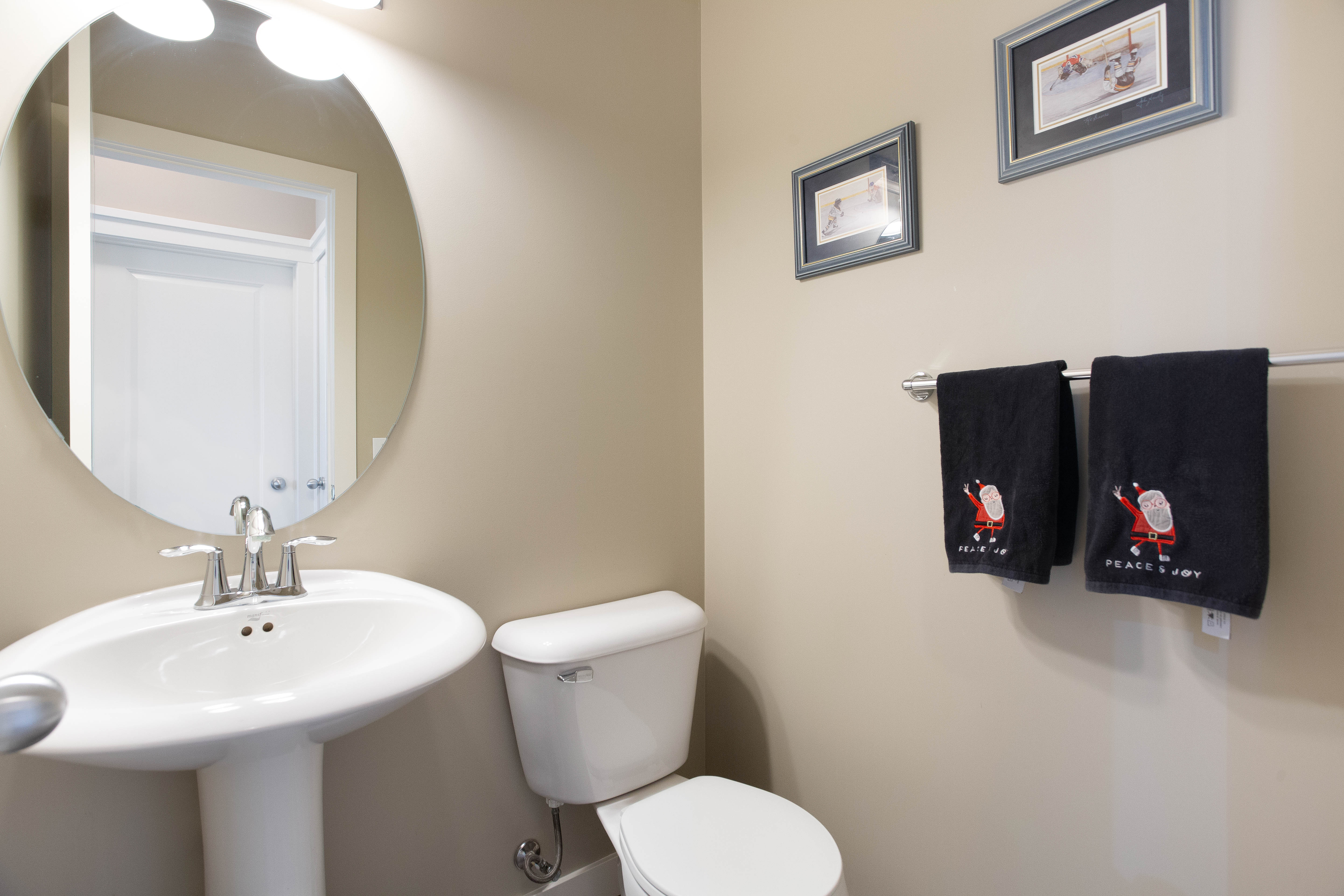 Main-floor half bathroom — 119 Sage Hill Green NW