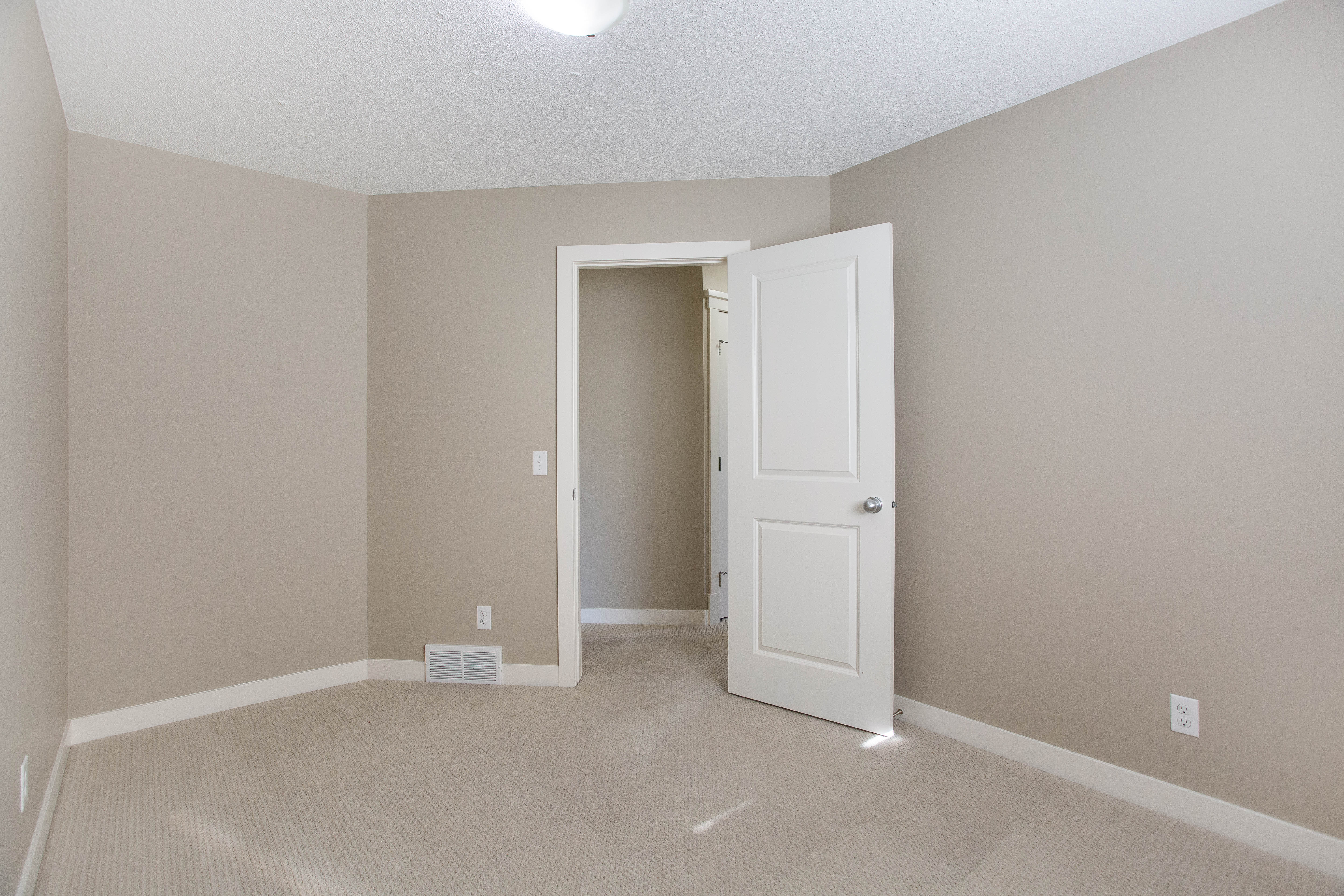 Bedroom with closet — 119 Sage Hill Green NW