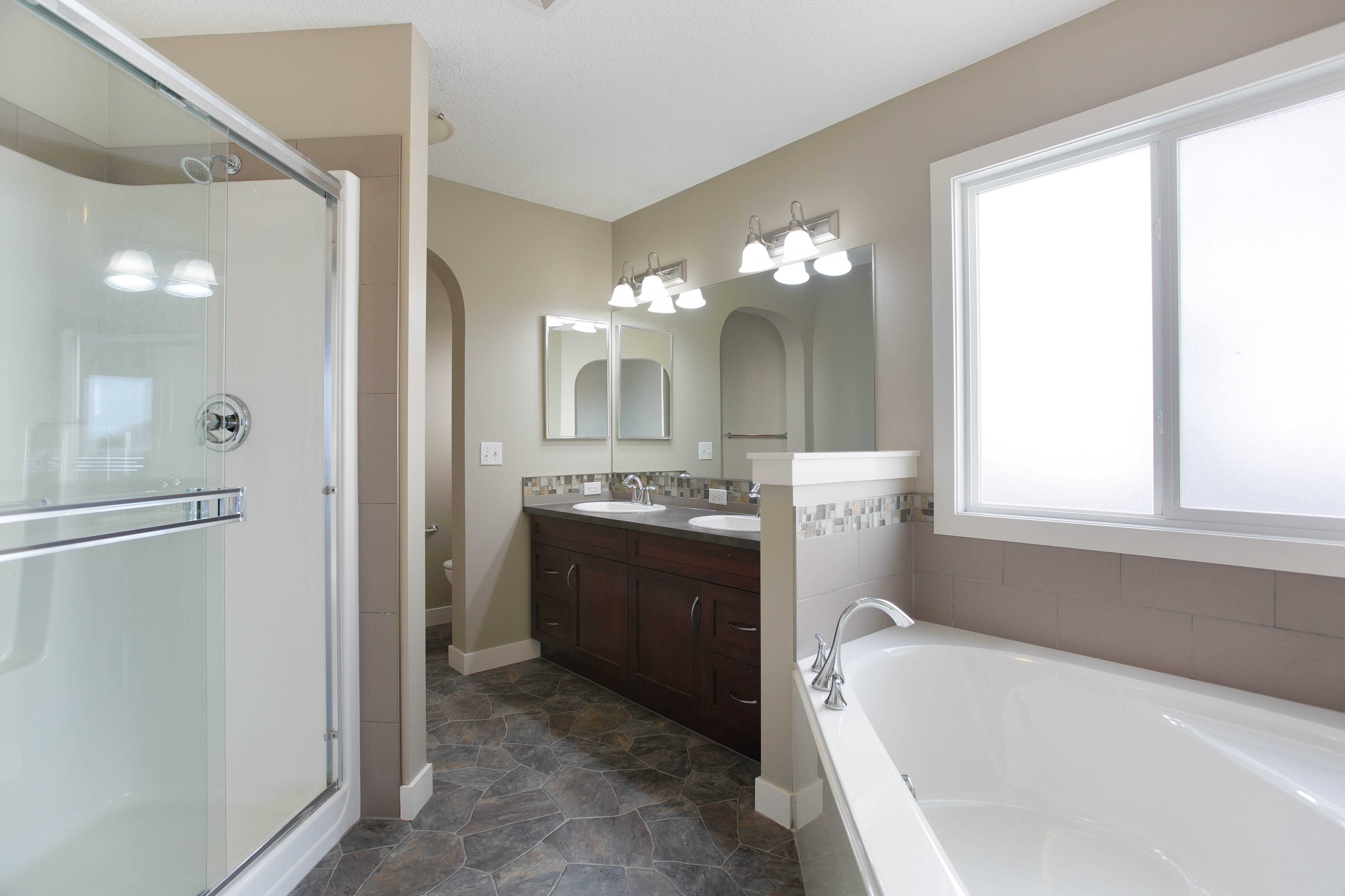 Primary ensuite double vanity and shower — 119 Sage Hill Green NW