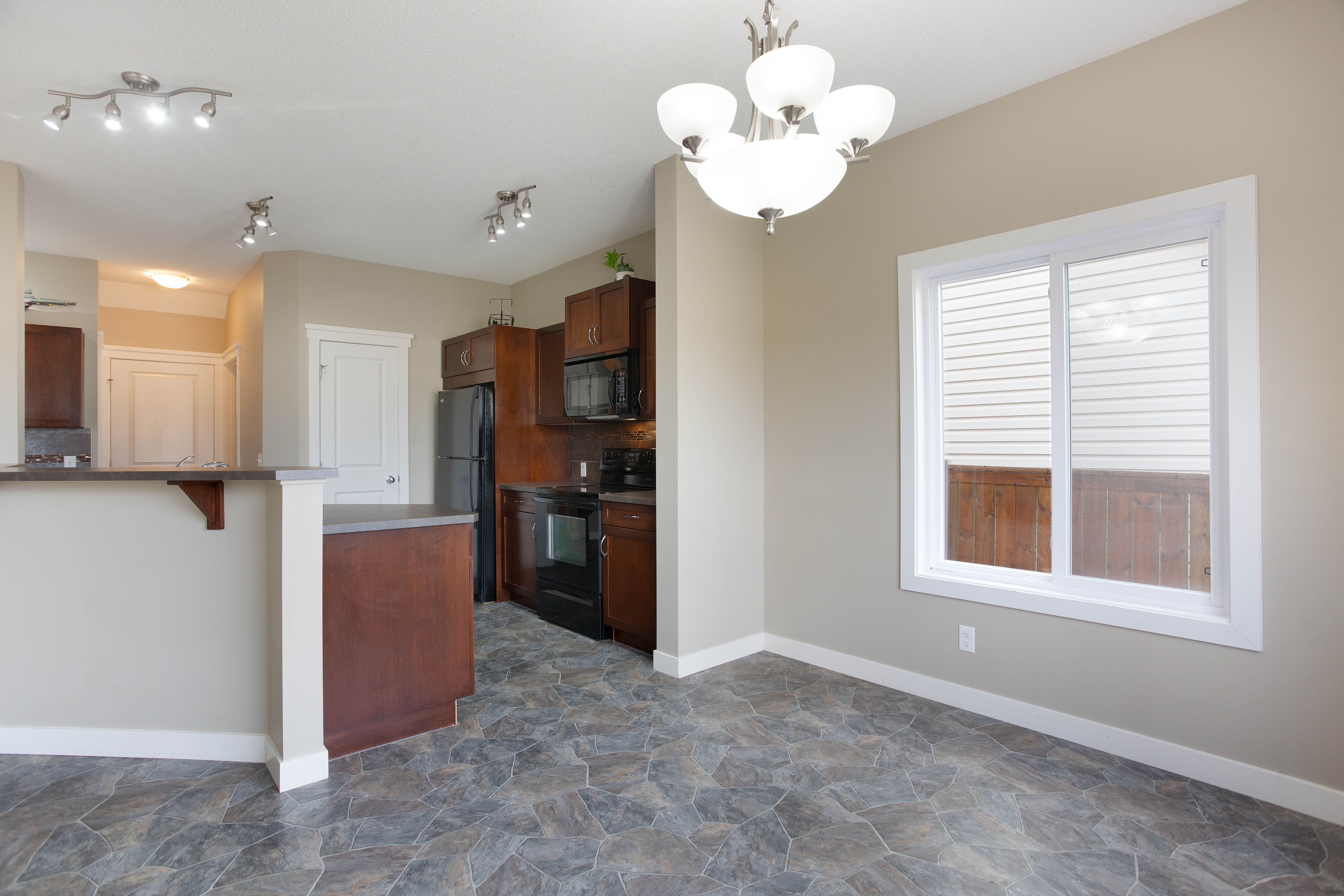 Dining area beside the kitchen — 119 Sage Hill Green NW