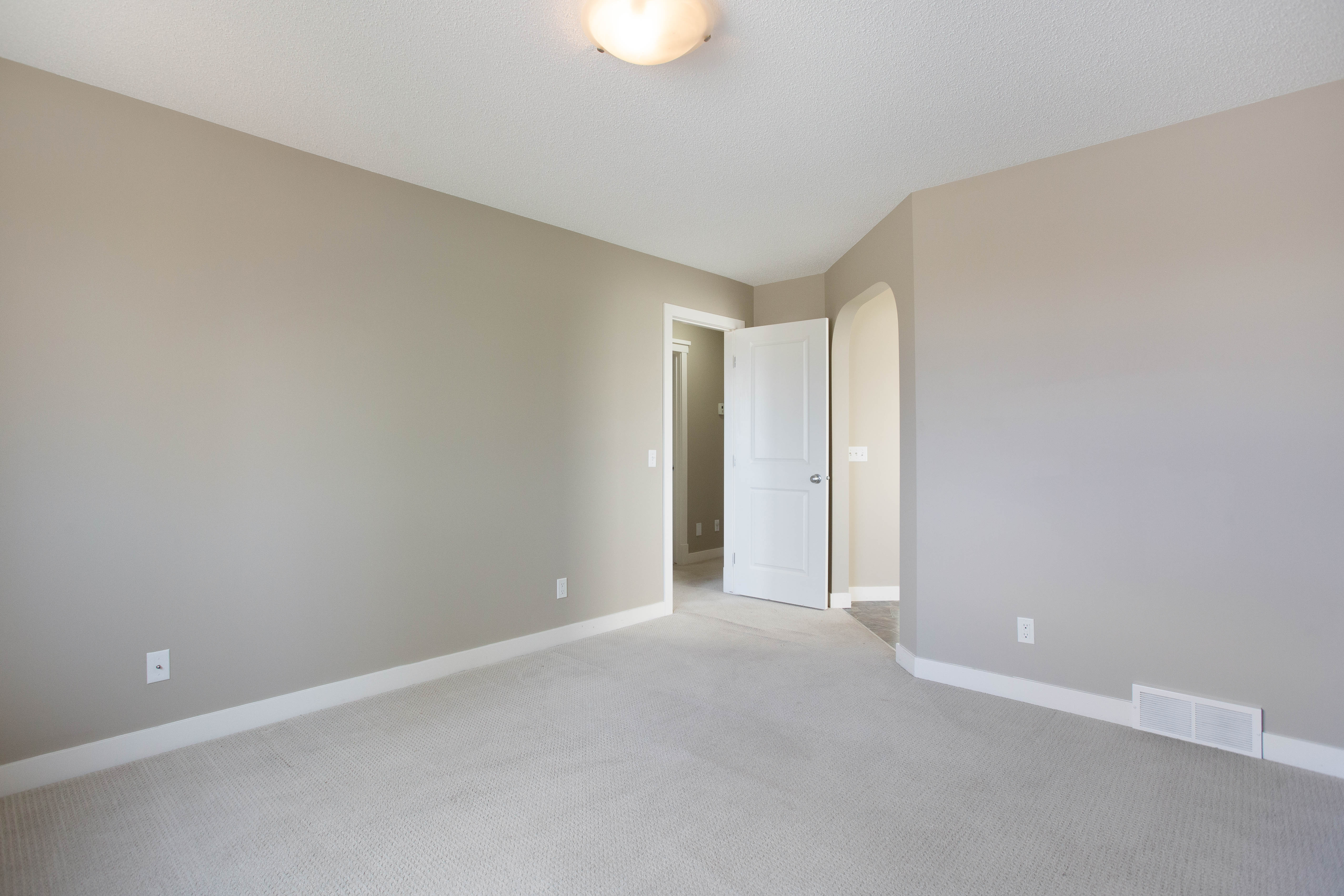 Primary bedroom with ensuite access — 119 Sage Hill Green NW