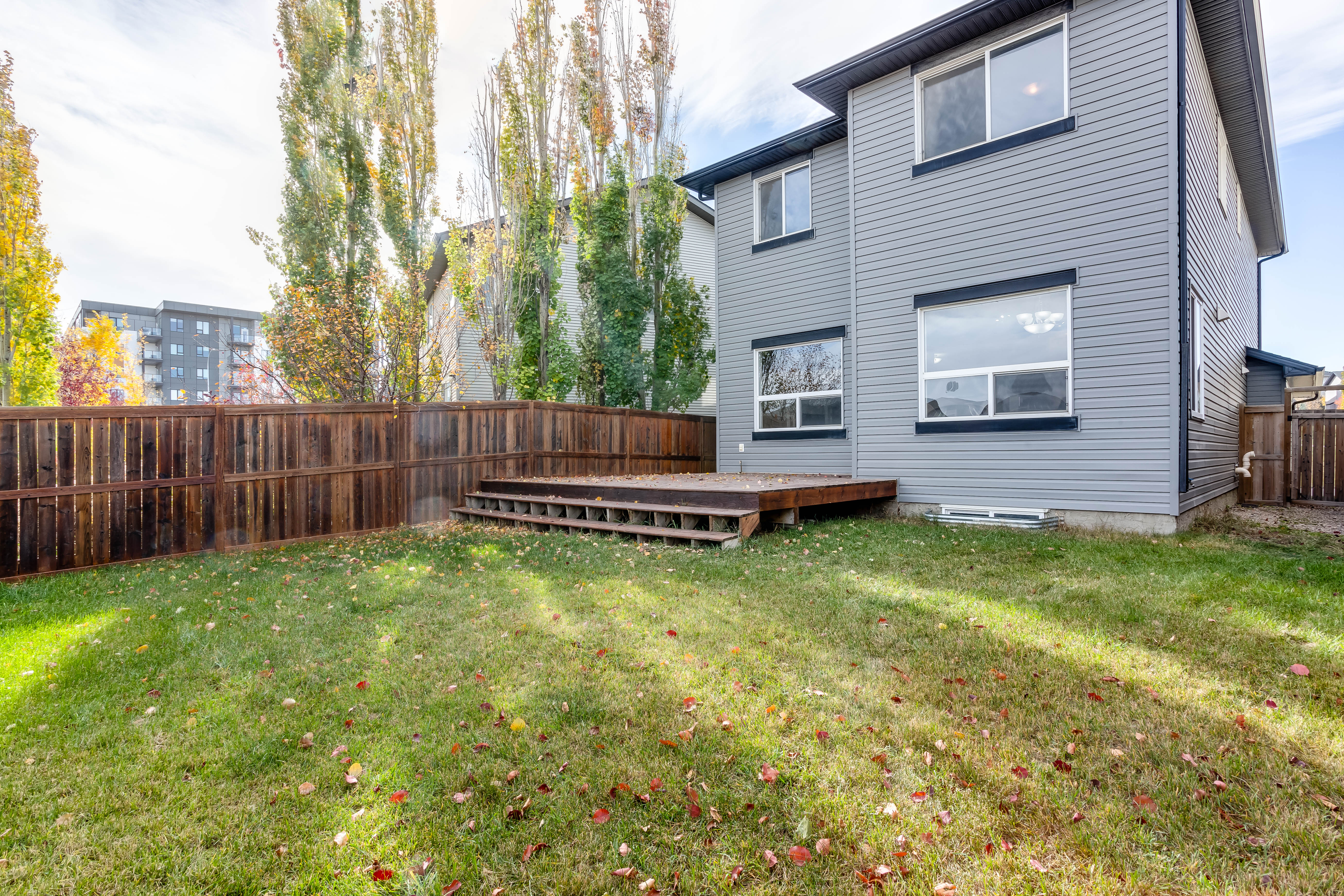 Rear elevation and lawn — 119 Sage Hill Green NW