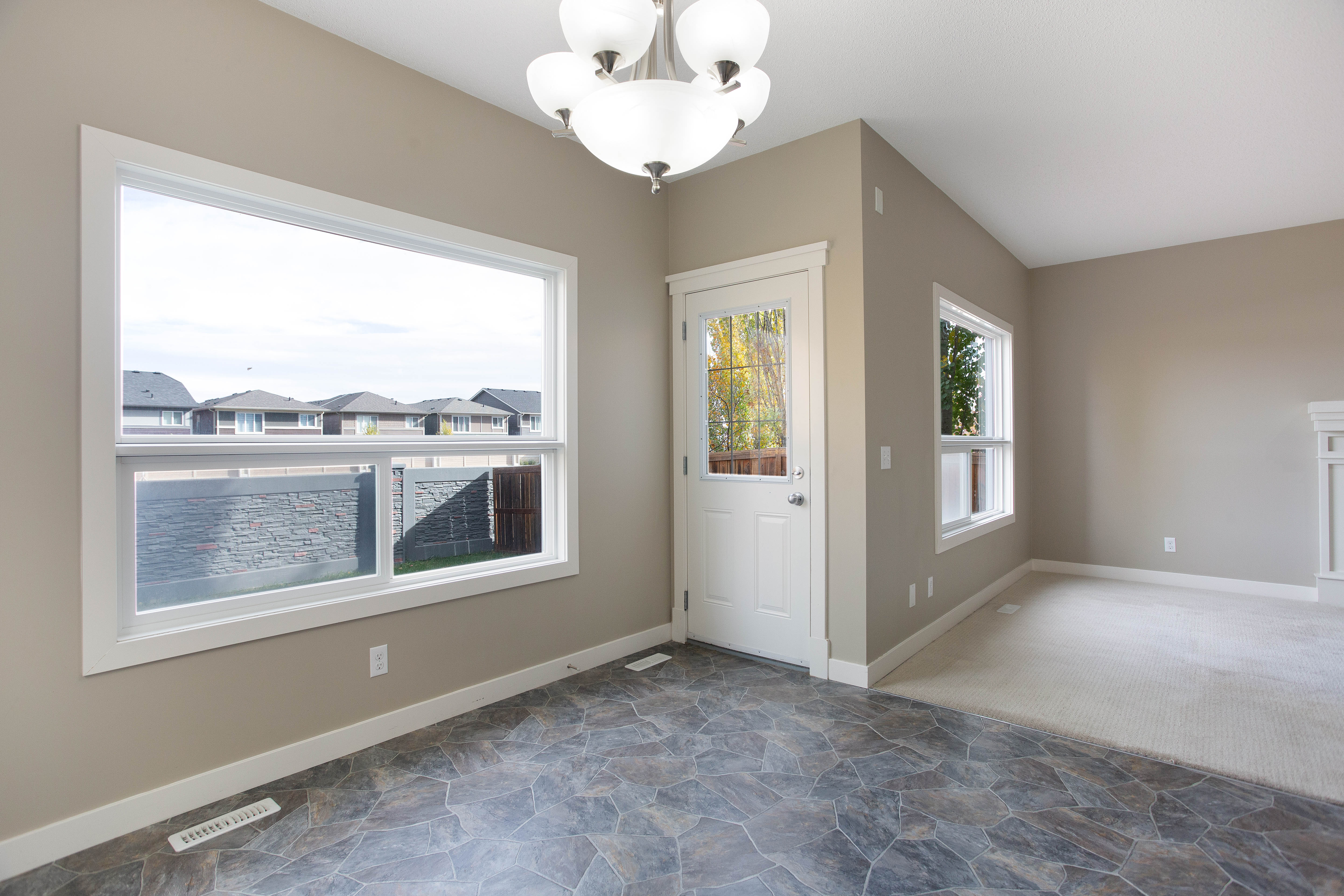 Dining and living spaces — 119 Sage Hill Green NW