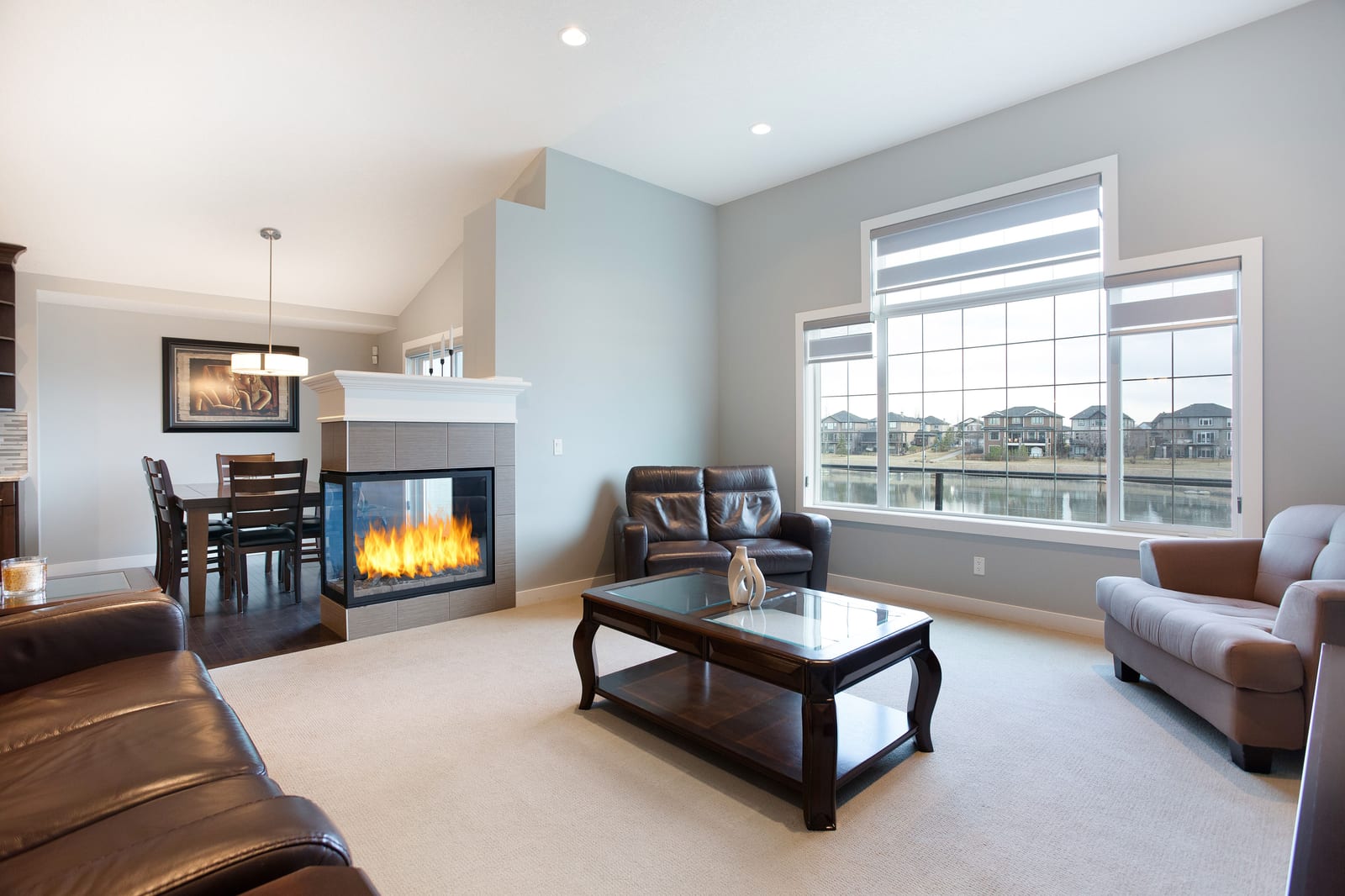 Main living room with fireplace and dining beyond