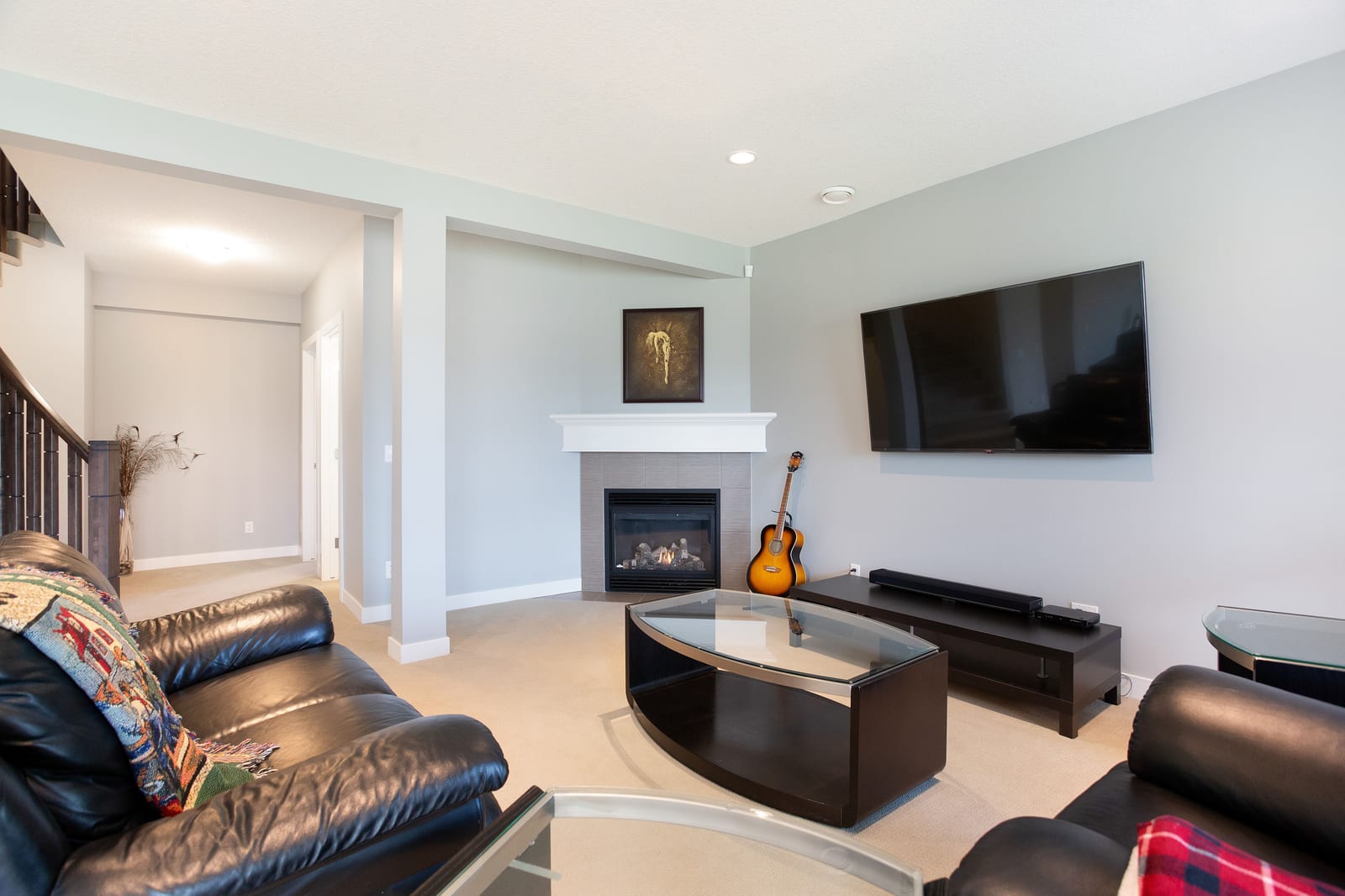 Lower-level living room with fireplace