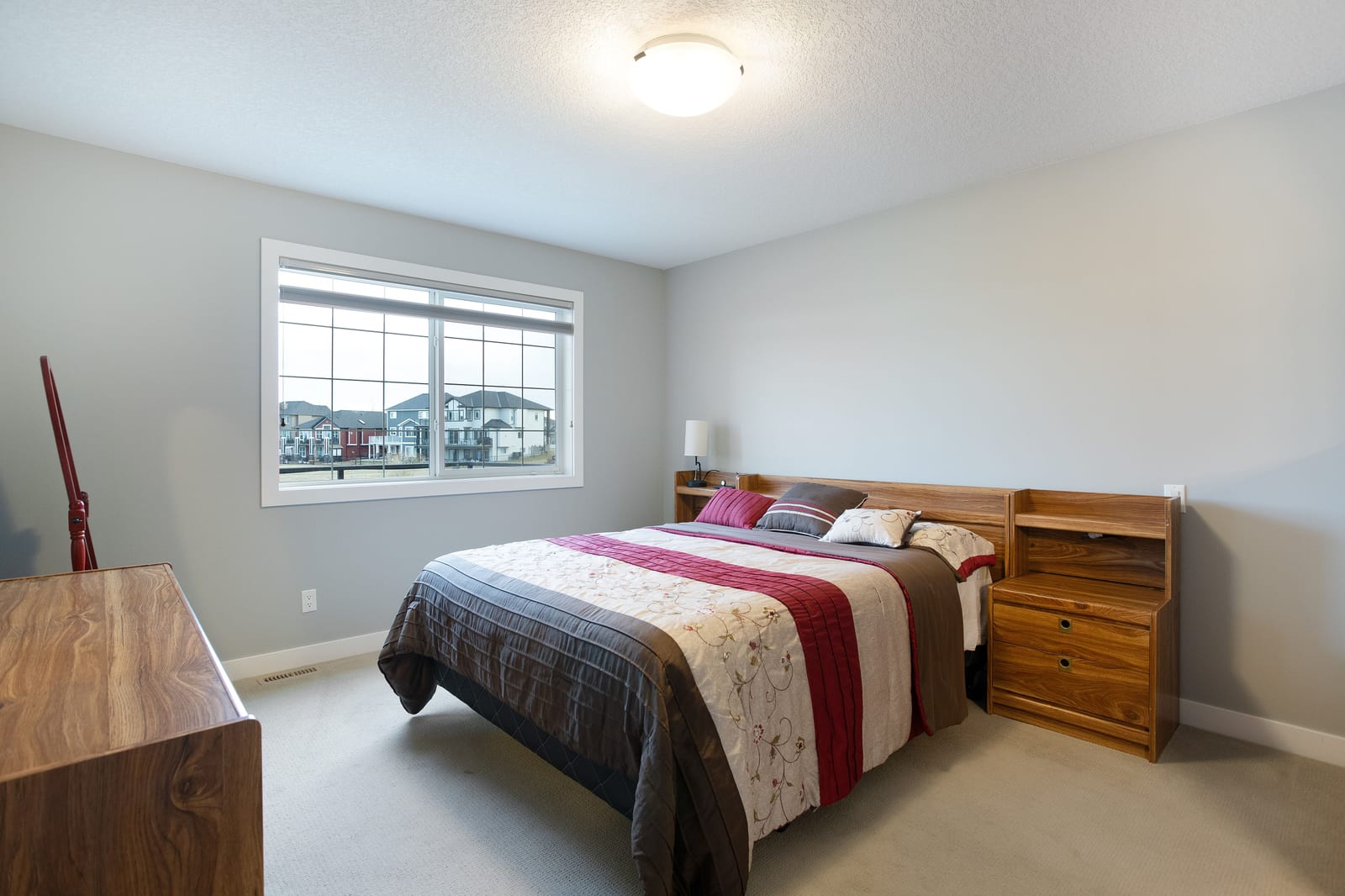 Main-floor bedroom with pond-facing window