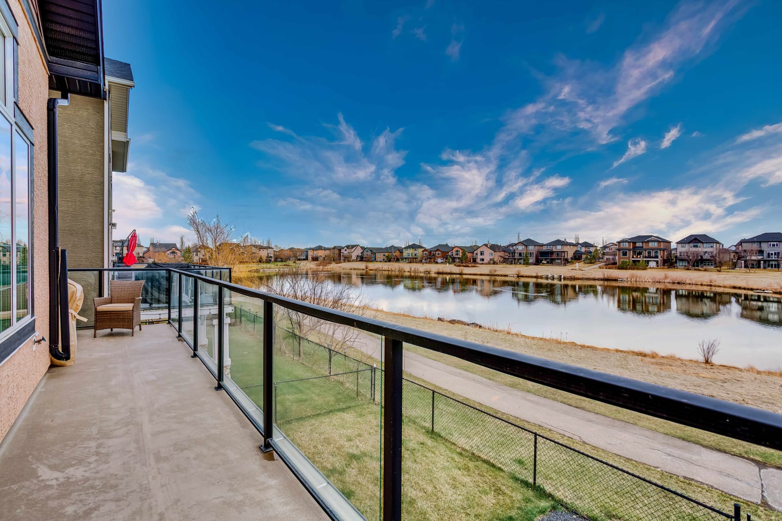 Deck with glass railing and water outlook