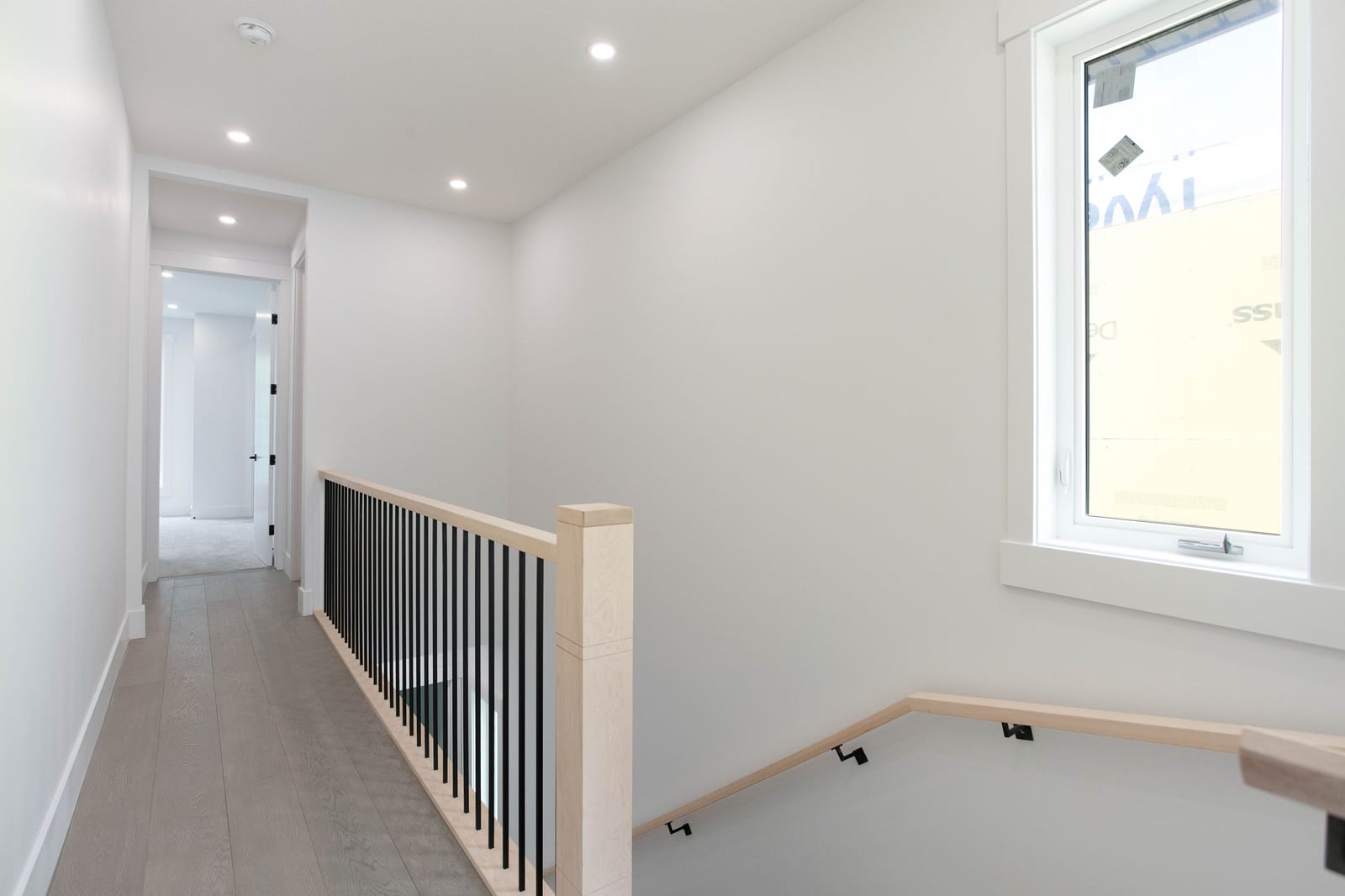 Upper hallway and staircase — supplied paired-home gallery; confirm 1106 finishes